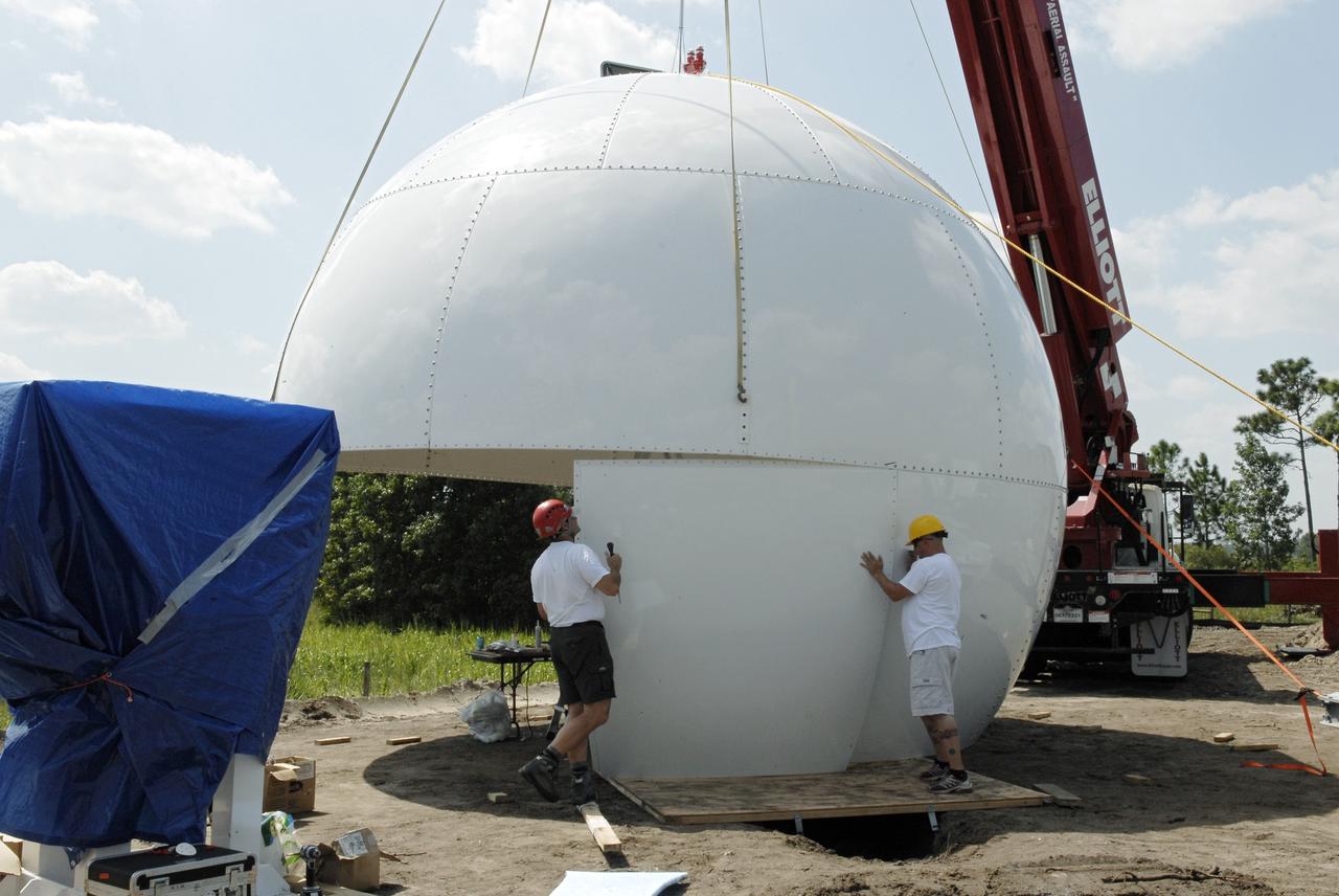 CAPE CANAVERAL, Fla. -  A new Doppler weather radar dome is being built in an area near S.R. 520 in Orange County, Florida. The new tower will replace one at nearby Patrick Air Force Base.  The site will be used by NASA's Kennedy Space Center, the 45th Space Wing and their customers. The tower will be able to monitor weather conditions directly above the launch pads at Kennedy. The weather radar is essential in issuing lightning and other severe weather warnings and vital in evaluating lightning launch commit criteria.  The new radar, replacing what was installed 25 years ago, includes Doppler capability to detect winds and identify the type, size and number of precipitation particles.  The site is ideally distant from the launch pads and has unobstructed views of Cape Canaveral Air Force Station and Kennedy. Photo credit: NASA/Kim Shiflett