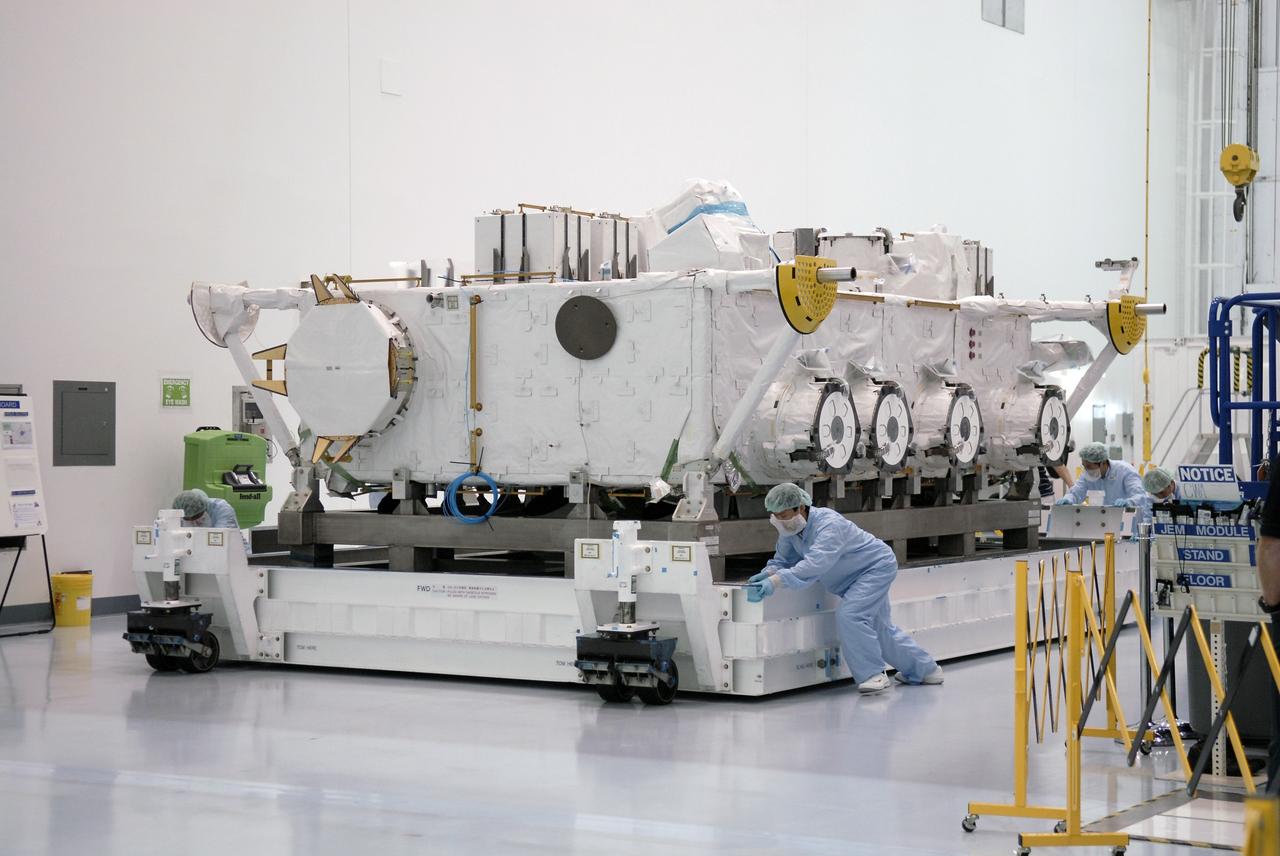 CAPE CANAVERAL, Fla. - After its shipping cover was removed, the Japan Aerospace Exploration Agency's Kibo Exposed Facility, or EF, is moved to a high bay in the Space Station Processing Facility at NASA's Kennedy Space Center in Florida. When it is installed on the Kibo laboratory, the EF will provide a multipurpose platform where science experiments can be deployed and operated in the exposed environment. The payloads attached to the EF can be exchanged or retrieved by Kibo's robotic arm, the JEM Remote Manipulator System. The EF, along with the Experiment Logistics Module Exposed Section, will be carried aboard space shuttle Endeavour on the STS-127 mission targeted for launch May 15, 2009. Photo credit: NASA/Kim Shiflett