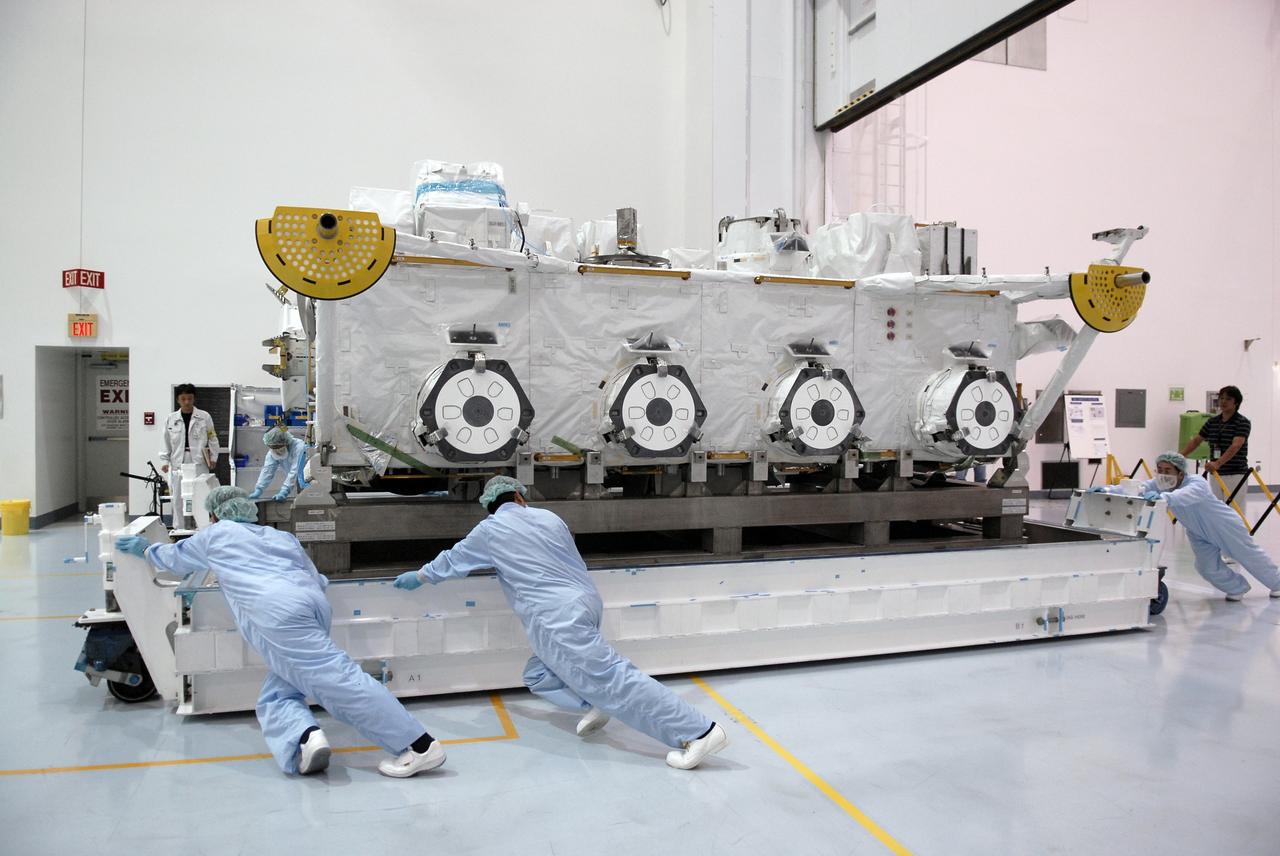 CAPE CANAVERAL, Fla. -   After its shipping cover was removed, the Japan Aerospace Exploration Agency's Kibo Exposed Facility is moved to a high bay in the Space Station Processing Facility, or EF,  at NASA's Kennedy Space Center in Florida. When it is installed on the Kibo laboratory, the EF will provide a multipurpose platform where science experiments can be deployed and operated in the exposed environment. The payloads attached to the EF can be exchanged or retrieved by Kibo's robotic arm, the JEM Remote Manipulator System. The EF, along with the Experiment Logistics Module Exposed Section,  will be carried aboard space shuttle Endeavour on the STS-127 mission targeted for launch May 15, 2009. Photo credit: NASA/Kim Shiflett