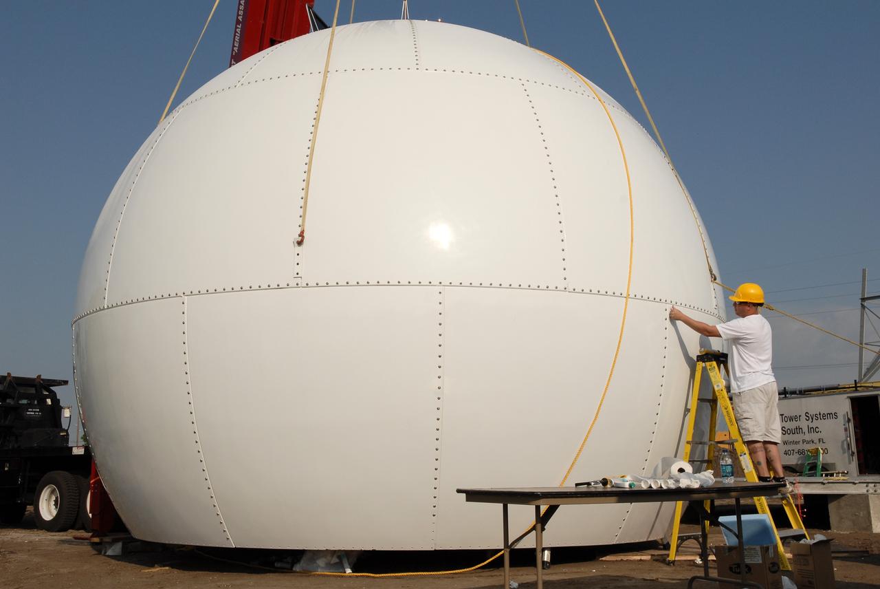 CAPE CANAVERAL, Fla. -   At a site near S.R. 520 in Orange County, Florida, a radar dome, or radome, is being completed before moving it to its base.  It is part of a new Doppler weather radar facility for the 45th Weather Squadron, replacing one at Patrick Air Force Base and will be used by NASA's Kennedy Space Center, the 45th Space Wing and their customers. The site will be able to monitor weather conditions directly above the launch pads at Kennedy. The weather radar is essential in issuing lightning and other severe weather warnings and vital in evaluating lightning launch commit criteria.  The new radar, replacing what was installed 25 years ago at Patrick Air Force Base, includes Doppler capability to detect winds and identify the type, size and number of precipitation particles.  The site is ideally distant from the launch pads and has unobstructed views of Cape Canaveral Air Force Station and Kennedy. The radar will be used by forecasters at the USAF 45th Weather Squadron. Photo credit: NASA/Troy Cryder
