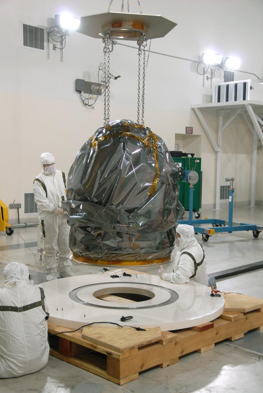 Vandenberg Air Force Base, Calif. – At Vandenberg Air Force Base in California, NASA’s Interstellar Boundary Explorer, or IBEX, is covered with protective material for a move to the stand in the foreground. The overhead crane will be attached to make the move. Designed to detect the edge of the Solar System, the IBEX satellite will make the first map of the boundary between the Solar System and interstellar space. IBEX is targeted for launch from the Kwajalein Atoll, a part of the Marshall Islands in the Pacific Ocean, on Oct. 19. Photo credit: NASA/Mark Mackley, VAFB
