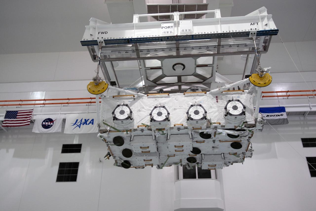 CAPE CANAVERAL, Fla. – In the Space Station Processing Facility at NASA's Kennedy Space Center in Florida, the Japan Aerospace Exploration Agency's Kibo Exposed Facility, or EF, is ready to be lowered onto a stand. The EF, along with the Experiment Logistics Module Exposed Section, will be carried aboard space shuttle Endeavour on the STS-127 mission to the International Space Station targeted for launch May 15, 2009. When it is installed on the Kibo laboratory,the EF will provide a multipurpose platform where science experiments can be deployed and operated in the exposed environment. The payloads attached to the EF can be exchanged or retrieved by Kibo's robotic arm, the JEM Remote Manipulator System. Photo credit: NASA/Kim Shiflett