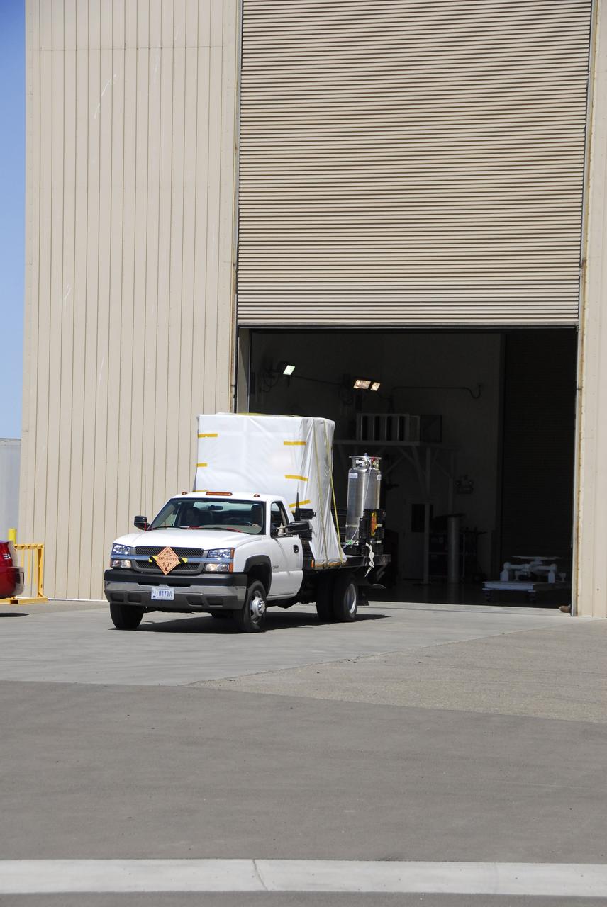 VANDENBERG AIR FORCE BASE, Calif. – The Interstellar Boundary Explorer, or IBEX, spacecraft leaves the Astrotech building to head for Hangar 1555 on Vandenberg Air Force Base in California. In the hangar, IBEX will be mated with the Pegasus XL rocket for launch. The IBEX satellite will make the first map of the boundary between the Solar System and interstellar space. IBEX is targeted for launch from the Kwajalein Atoll, a part of the Marshall Islands in the Pacific Ocean, on Oct. 19 aboard the Pegasus rocket dropped from under the wing of an L-1011 aircraft flying over the Pacific Ocean. The Pegasus will carry the spacecraft approximately 130 miles above Earth and place it in orbit. Photo credit: NASA/Dan Liberotti, VAFB