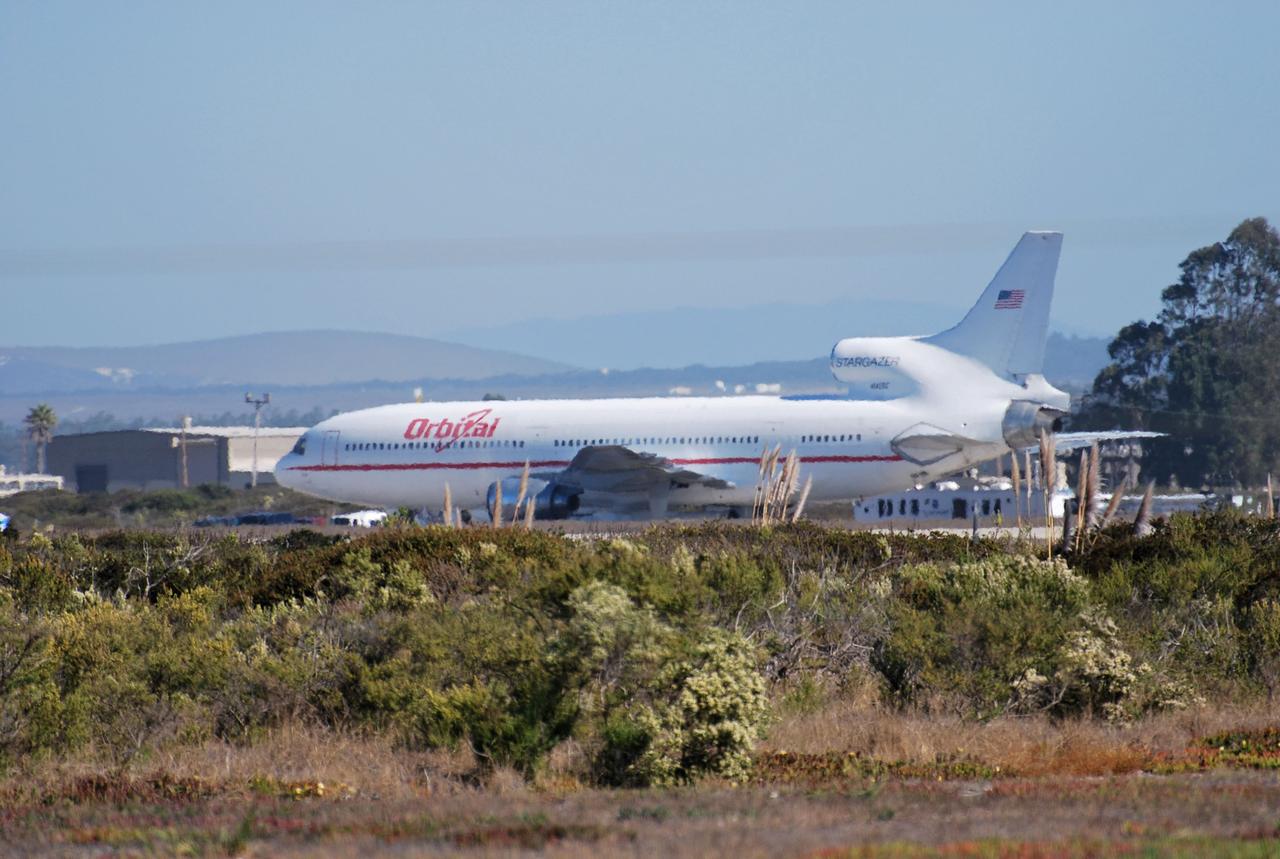 VANDENBERG AIR FORCE BASE, Calif. – On the ramp of Vandenberg Air Force Base in California, Orbital Sciences’ L-1011 aircraft is ready for departure with NASA’s Interstellar Boundary Explorer, or IBEX, spacecraft and Pegasus XL rocket. The Pegasus is attached under the wing of the aircraft for launch. The IBEX satellite will make the first map of the boundary between the Solar System and interstellar space. IBEX is targeted for launch Oct. 19. The Pegasus rocket will be dropped from under the wing of the L-1011 over the Pacific Ocean to carry the spacecraft approximately 130 miles above Earth and place it in orbit. Photo credit: NASA/Randy Beaudoin, VAFB