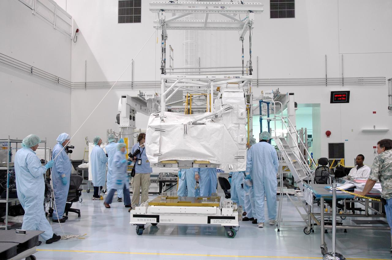 CAPE CANAVERAL, FIa. -- In the Space Station Processing Facility at NASA's Kennedy Space Center in Florida, an overhead crane lifts the flexible hose rotary coupler. The coupler will be moved to the Lightweight Multi-Purpose Experiment Support Structure Carrier for installation. The carrier will be installed in space shuttle Endeavour for the STS-126 mission to the International Space Station. The 15-day flight will deliver equipment and supplies to the space station in preparation for expansion from a three- to six-person resident crew aboard the complex. The mission also will include four spacewalks to service the station’s Solar Alpha Rotary Joints. Photo credit: NASA/Jim Grossmann