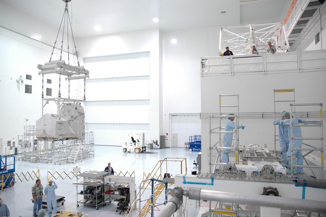 CAPE CANAVERAL, FIa. -- Amid the crowded hardware of the Space Station Processing Facility at NASA's Kennedy Space Center in Florida, the flexible hose rotary coupler is moved across the floor for installation onto Lightweight Multi-Purpose Experiment Support Structure Carrier. The carrier will be installed in space shuttle Endeavour for the STS-126 mission to the International Space Station. The 15-day flight will deliver equipment and supplies to the space station in preparation for expansion from a three- to six-person resident crew aboard the complex. The mission also will include four spacewalks to service the station’s Solar Alpha Rotary Joints. Photo credit: NASA/Jim Grossmann
