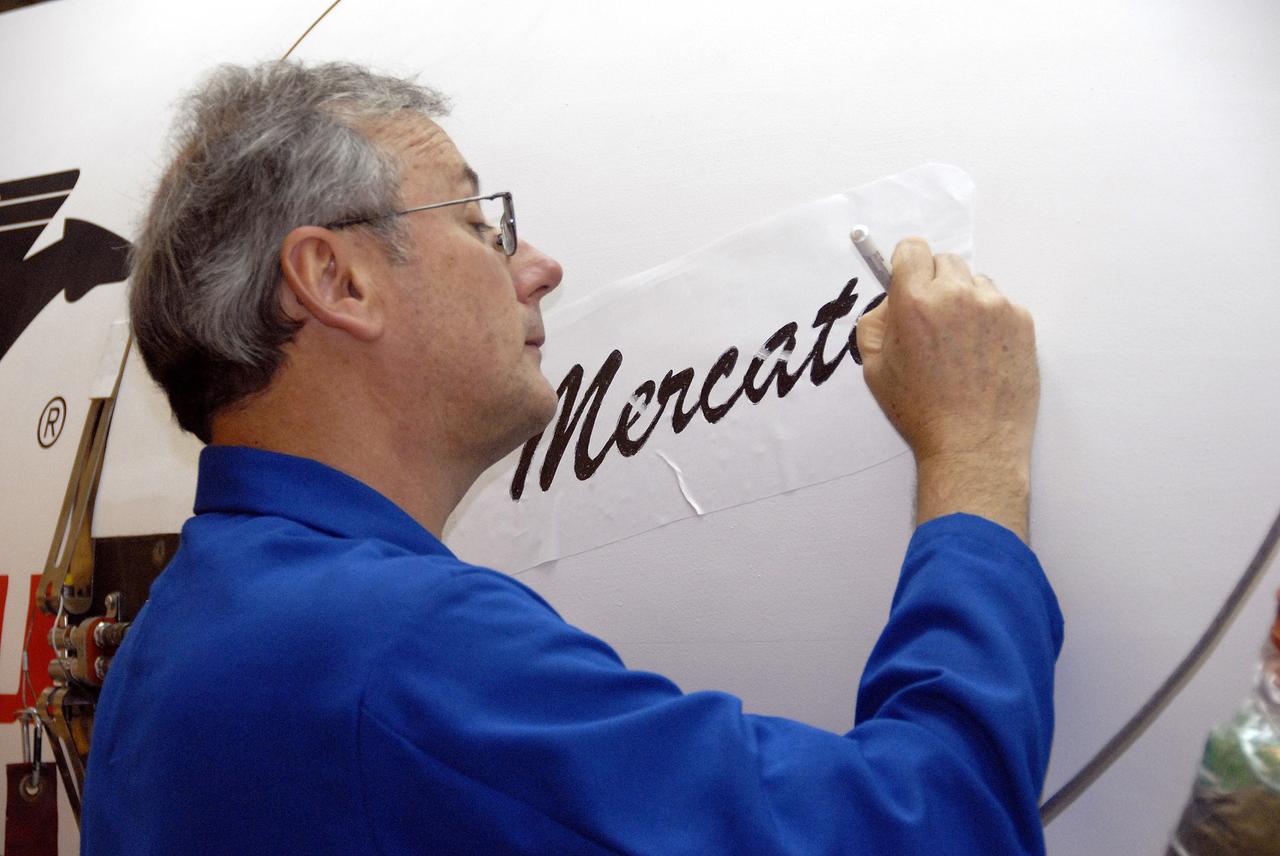 VANDENBERG AIR FORCE BASE, Calif. – In Hangar 1555 on Vandenberg Air Force Base in California, a worker paints the name “Mercator” on the nose of the Pegasus XL rocket. The rocket is the launch vehicle for NASA’s Interstellar Boundary Explorer, or IBEX, spacecraft. The IBEX satellite will make the first map of the boundary between the Solar System and interstellar space. The name Mercator was chosen in honor of Gerardus Mercator, the Flemish cartographer (or map maker). In addition to the many maps that he made, he also invented a technique to create terrestrial and celestial globes out of paper mache, allowing for greater production than the carved wooden or brass globes that were previously used. IBEX is targeted for launch from the Kwajalein Atoll, a part of the Marshall Islands in the Pacific Ocean, on Oct. 19. IBEX will be launched aboard the Pegasus rocket dropped from under the wing of an L-1011 aircraft flying over the Pacific Ocean. The Pegasus will carry the spacecraft approximately 130 miles above Earth and place it in orbit. Photo credit: NASA/R. Bledsoe, VAFB