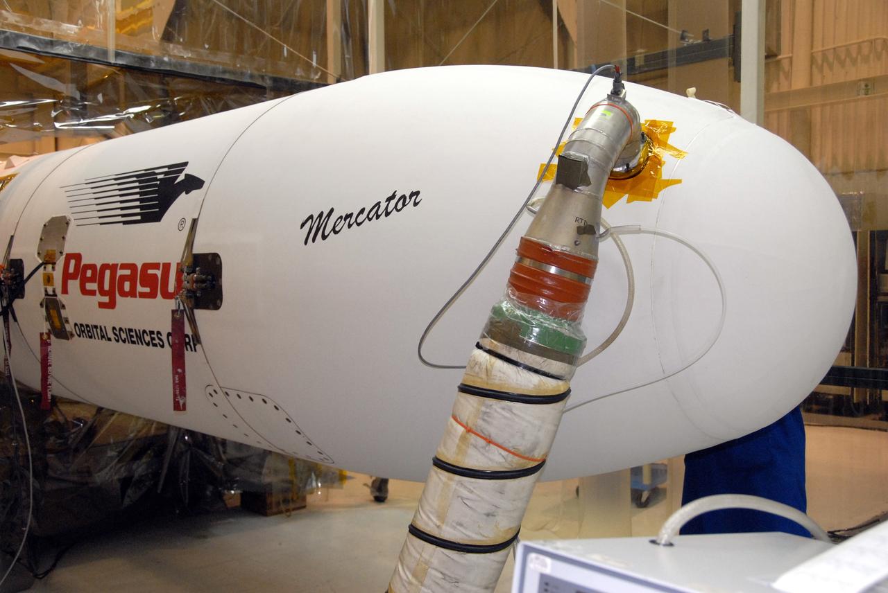 VANDENBERG AIR FORCE BASE, Calif. – In Hangar 1555 on Vandenberg Air Force Base in California, the name “Mercator” is displayed on the nose of the Pegasus XL rocket. The rocket is the launch vehicle for NASA’s Interstellar Boundary Explorer, or IBEX, spacecraft. The IBEX satellite will make the first map of the boundary between the Solar System and interstellar space. The name Mercator was chosen in honor of Gerardus Mercator, the Flemish cartographer (or map maker). In addition to the many maps that he made, he also invented a technique to create terrestrial and celestial globes out of paper mache, allowing for greater production than the carved wooden or brass globes that were previously used. IBEX is targeted for launch from the Kwajalein Atoll, a part of the Marshall Islands in the Pacific Ocean, on Oct. 19. IBEX will be launched aboard the Pegasus rocket dropped from under the wing of an L-1011 aircraft flying over the Pacific Ocean. The Pegasus will carry the spacecraft approximately 130 miles above Earth and place it in orbit. Photo credit: NASA/R. Bledsoe, VAFB