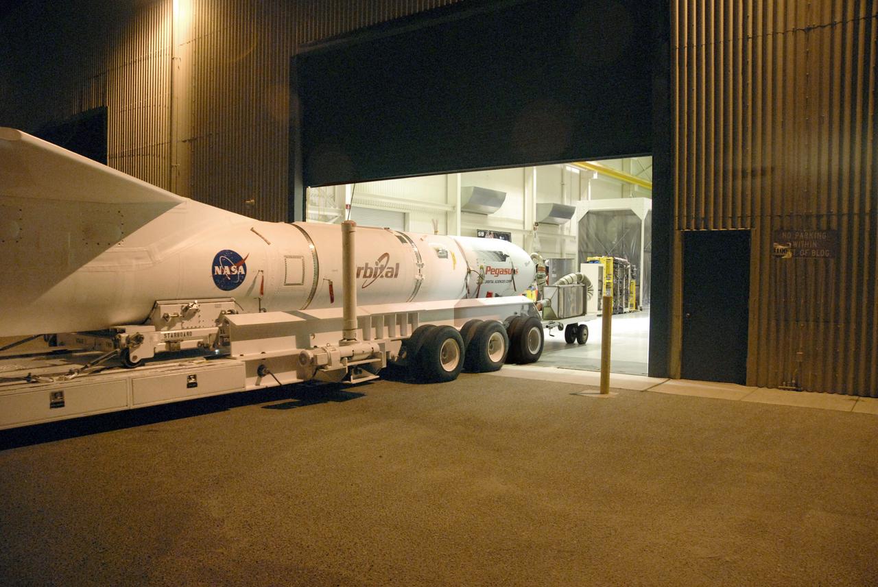 VANDENBERG AIR FORCE BASE, Fla. -- NASA’s Interstellar Boundary Explorer, or IBEX, spacecraft and mated Pegasus XL rocket leave Hangar 1555 on a transporter to head for the ramp on Vandenberg Air Force Base in California. There, the rocket will be attached to Orbital Sciences’ L-1011 aircraft for launch. IBEX is targeted for launch from the Kwajalein Atoll, a part of the Marshall Islands in the Pacific Ocean, on Oct. 19. IBEX will be launched aboard the Pegasus rocket dropped from under the wing of the L-1011 aircraft flying over the Pacific Ocean. The Pegasus will carry the spacecraft approximately 130 miles above Earth and place it in orbit. The IBEX satellite will make the first map of the boundary between the Solar System and interstellar space. Photo credit: NASA/Mark Mackley, VAFB