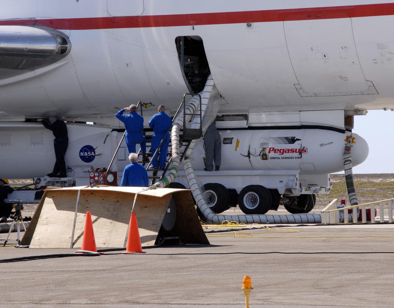 VANDENBERG AIR FORCE BASE, Fla. -- NASA’s Interstellar Boundary Explorer, or IBEX, spacecraft and mated Pegasus XL rocket are being attached to Orbital Sciences’ L-1011 aircraft for launch. IBEX is targeted for launch from the Kwajalein Atoll, a part of the Marshall Islands in the Pacific Ocean, on Oct. 19. IBEX will be launched aboard the Pegasus rocket dropped from under the wing of the L-1011 aircraft flying over the Pacific Ocean. The Pegasus will carry the spacecraft approximately 130 miles above Earth and place it in orbit. The IBEX satellite will make the first map of the boundary between the Solar System and interstellar space. Photo credit: NASA/Mark Mackley, VAFB