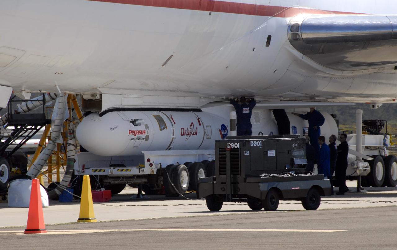 VANDENBERG AIR FORCE BASE, Fla. -- NASA’s Interstellar Boundary Explorer, or IBEX, spacecraft and mated Pegasus XL rocket are being attached to Orbital Sciences’ L-1011 aircraft for launch. IBEX is targeted for launch from the Kwajalein Atoll, a part of the Marshall Islands in the Pacific Ocean, on Oct. 19. IBEX will be launched aboard the Pegasus rocket dropped from under the wing of the L-1011 aircraft flying over the Pacific Ocean. The Pegasus will carry the spacecraft approximately 130 miles above Earth and place it in orbit. The IBEX satellite will make the first map of the boundary between the Solar System and interstellar space. Photo credit: NASA/Mark Mackley, VAFB