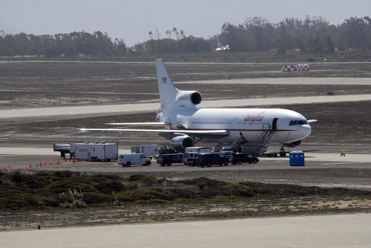VANDENBERG AIR FORCE BASE, Calif. –  On the ramp of Vandenberg Air Force Base in California, Orbital Sciences’ L-1011 aircraft awaits departure for the Kwajalein Atoll, a part of the Marshall Islands in the Pacific Ocean, with NASA’s Interstellar Boundary Explorer, or IBEX, spacecraft and Pegasus XL rocket. The Pegasus is attached under the wing of the aircraft for launch. Departing from Kwajalein, the Pegasus rocket will be dropped from under the wing of the L-1011 over the Pacific Ocean to carry the spacecraft approximately 130 miles above Earth and place it in orbit.  Then, the spacecraft’s own engine will boost it to its final high-altitude orbit (about 200,000 miles high) — most of the way to the Moon. The IBEX satellite will make the first map of the boundary between the Solar System and interstellar space.  IBEX science will be led by the Southwest Research Institute of San Antonio, Texas.  IBEX is targeted for launch over the Pacific Oct. 19.   Photo credit: NASA/CIV USAF/Daniel Liberotti