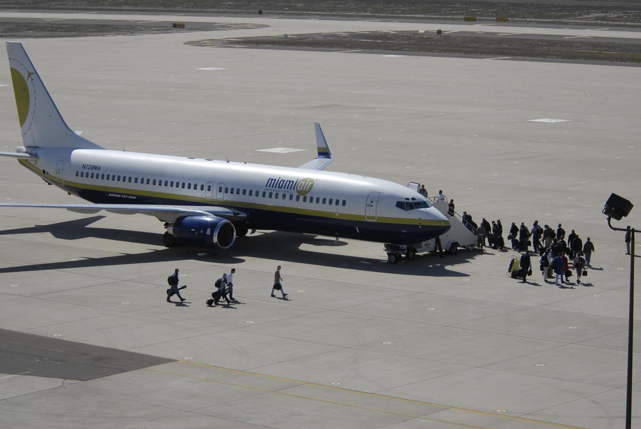 VANDENBERG AIR FORCE BASE, Calif. –   On the ramp of Vandenberg Air Force Base in California, the contingency crew and launch team members for NASA’s Interstellar Boundary Explorer, or IBEX, spacecraft embark on the Pathfinder aircraft that will accompany Orbital Sciences’ L-1011 aircraft.  The L-1011 will carry IBEX and Pegasus XL rocket on its flight to the Kwajalein Atoll, a part of the Marshall Islands in the Pacific Ocean.  Departing from Kwajalein, the Pegasus rocket will be dropped from under the wing of the L-1011 over the Pacific Ocean to carry the spacecraft approximately 130 miles above Earth and place it in orbit.  Then, the spacecraft’s own engine will boost it to its final high-altitude orbit (about 200,000 miles high) — most of the way to the Moon. The IBEX satellite will make the first map of the boundary between the Solar System and interstellar space.  IBEX science will be led by the Southwest Research Institute of San Antonio, Texas.  IBEX is targeted for launch over the Pacific Oct. 19.   Photo credit: NASA/CIV USAF/Daniel Liberotti