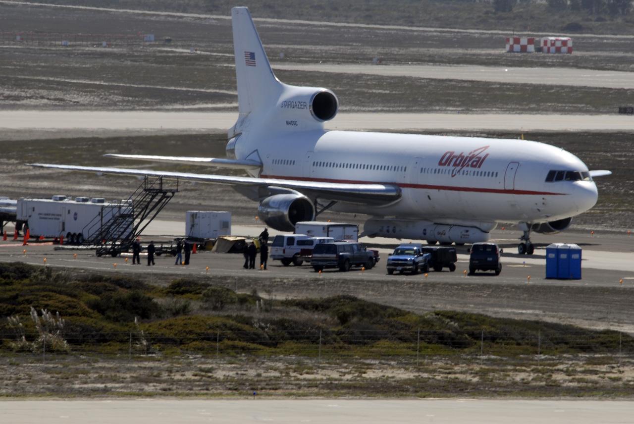 VANDENBERG AIR FORCE BASE, Calif. –  On the ramp of Vandenberg Air Force Base in California, Orbital Sciences’ L-1011 aircraft awaits departure for the Kwajalein Atoll, a part of the Marshall Islands in the Pacific Ocean, with NASA’s Interstellar Boundary Explorer, or IBEX, spacecraft and Pegasus XL rocket. The Pegasus is attached under the wing of the aircraft for launch.   Departing from Kwajalein, the Pegasus rocket will be dropped from under the wing of the L-1011 over the Pacific Ocean to carry the spacecraft approximately 130 miles above Earth and place it in orbit.  Then, the spacecraft’s own engine will boost it to its final high-altitude orbit (about 200,000 miles high) — most of the way to the Moon. The IBEX satellite will make the first map of the boundary between the Solar System and interstellar space.  IBEX science will be led by the Southwest Research Institute of San Antonio, Texas.  IBEX is targeted for launch over the Pacific Oct. 19.   Photo credit: NASA/CIV USAF/Daniel Liberotti
