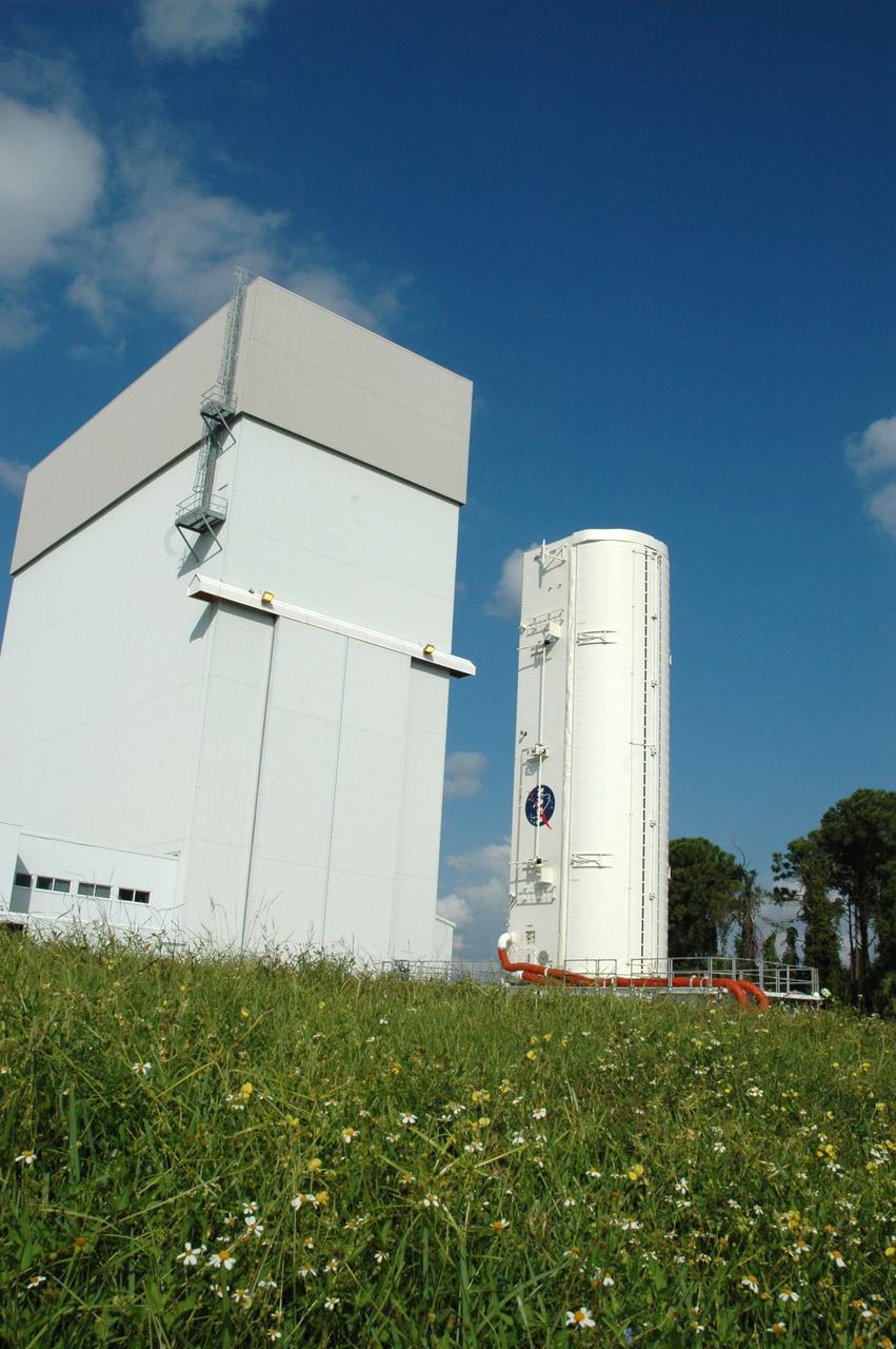 CAPE CANAVERAL, Fla. – On NASA's Kennedy Space Center in Florida, the canister with space shuttle Atlantis’ Hubble Space Telescope payload inside heads toward the Canister Rotation Facility. The payload comprises four carriers holding various equipment for the mission. After rotation to horizontal, the canister will be transported back to Kennedy’s Payload Hazardous Servicing Facility where the hardware will be stored until a new target launch date can be set for Atlantis’ STS-125 mission in 2009. Atlantis’ October target launch date was delayed after a device on board Hubble used in the storage and transmission of science data to Earth shut down on Sept. 27. Replacing the broken device will be added to Atlantis’ servicing mission to the telescope Photo credit: NASA/Tim Jacobs