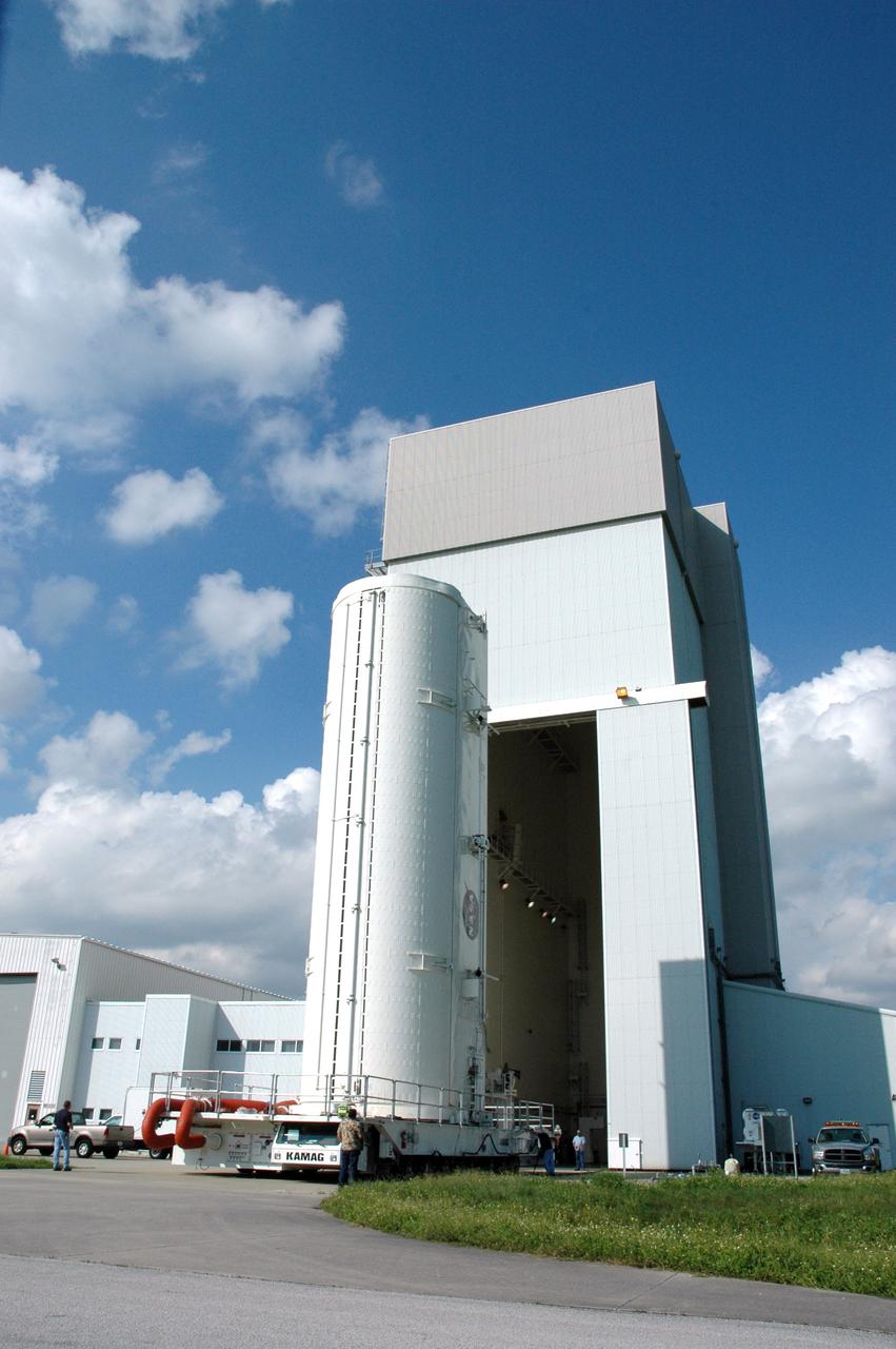 CAPE CANAVERAL, Fla. – On NASA's Kennedy Space Center in Florida, the canister with space shuttle Atlantis’ Hubble Space Telescope payload inside heads for the open doors of the Canister Rotation Facility. The payload comprises four carriers holding various equipment for the mission. After rotation to horizontal, the canister will be transported back to Kennedy’s Payload Hazardous Servicing Facility where the hardware will be stored until a new target launch date can be set for Atlantis’ STS-125 mission in 2009. Atlantis’ October target launch date was delayed after a device on board Hubble used in the storage and transmission of science data to Earth shut down on Sept. 27. Replacing the broken device will be added to Atlantis’ servicing mission to the telescope Photo credit: NASA/Tim Jacobs