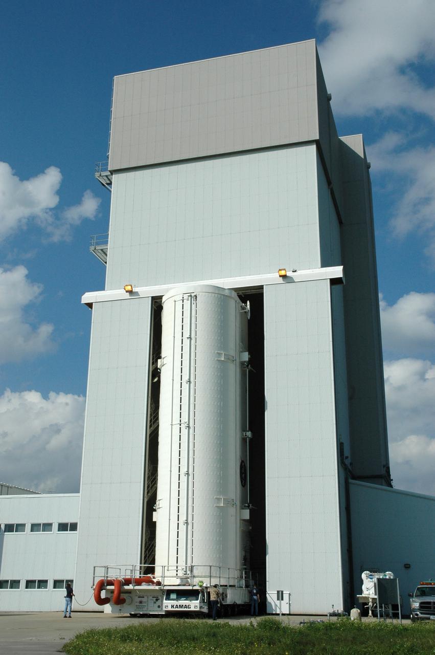 CAPE CANAVERAL, Fla. – On NASA's Kennedy Space Center in Florida, the canister with space shuttle Atlantis’ Hubble Space Telescope payload inside roll through the open doors of the Canister Rotation Facility.  The payload comprises four carriers holding various equipment for the mission. After rotation to horizontal, the canister will be transported back to Kennedy’s Payload Hazardous Servicing Facility where the hardware will be stored until a new target launch date can be set for Atlantis’ STS-125 mission in 2009. Atlantis’ October target launch date was delayed after a device on board Hubble used in the storage and transmission of science data to Earth shut down on Sept. 27. Replacing the broken device will be added to Atlantis’ servicing mission to the telescope Photo credit: NASA/Tim Jacobs