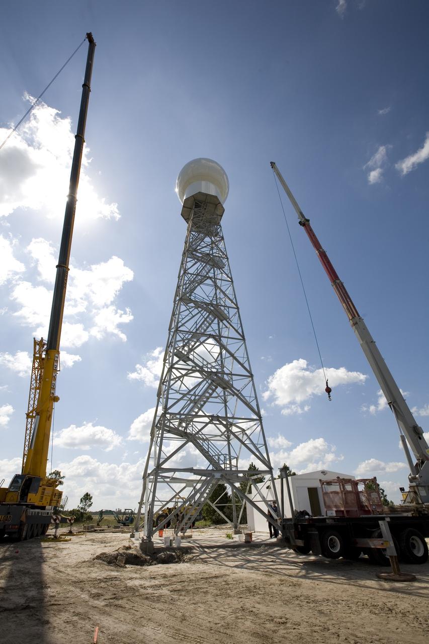 CAPE CANAVERAL, Fla. - The radome is secured atop a new Doppler weather radar tower being built in an area near S.R. 520 in Orange County, Fla. The dome houses the weather radar dish and pedestal and protects them from the elements. The new tower will replace one at nearby Patrick Air Force Base and will be used by NASA's Kennedy Space Center, the 45th Space Wing and their customers. The tower will be able to monitor weather conditions directly above the launch pads at Kennedy. The weather radar is essential in issuing lightning and other severe weather warnings and vital in evaluating lightning launch commit criteria. The new radar, replacing what was installed 25 years ago, includes Doppler capability to detect winds and identify the type, size and number of precipitation particles. The site is ideally distant from the launch pads and has unobstructed views of Cape Canaveral Air Force Station and Kennedy. Photo credit: NASA/Dimitri Gerondidakis