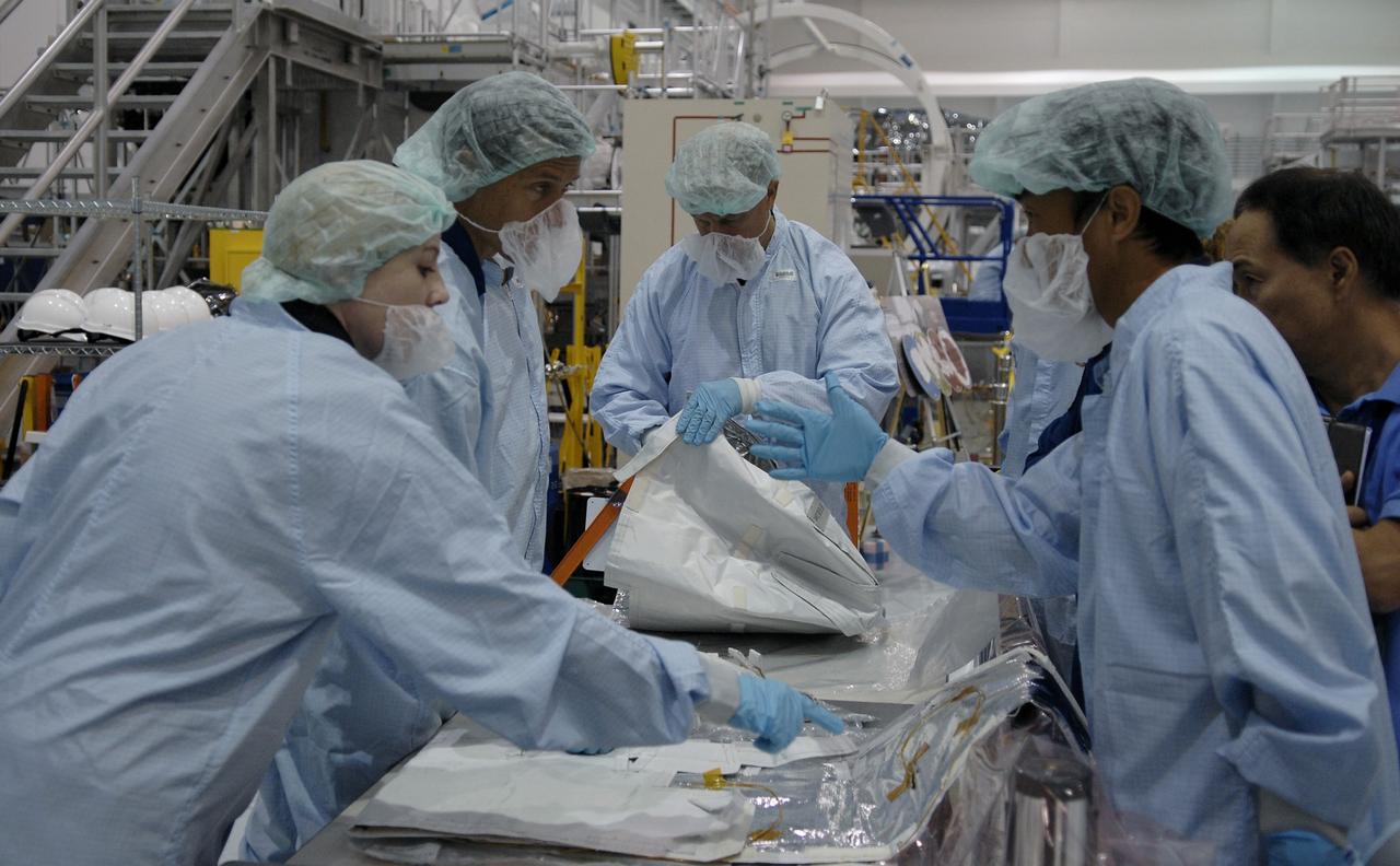 CAPE CANAVERAL, Fla. – In the Space Station Processing Facility at NASA's Kennedy Space Center in Florida, STS-127 mission crew members get hands-on familiarization with equipment to be used on the mission. Crew members are Commander Mark Polansky, Pilot Doug Hurley and Mission Specialists Christopher Cassidy, Tom Marshburn, Dave Wolf, Julie Payette and Tim Kopra. The mission payload includes the Japanese Experiment Module, or JEM, Extended Facility and the Inter-orbit Communication System Extended Facility, or ICS-EF. Equipment familiarization is part of a Crew Equipment Interface Test. The payload will be launched to the International Space Station aboard the space shuttle Endeavour on the STS-127 mission, targeted for launch on May 15, 2009. Photo credit: NASA/Kim Shiflett