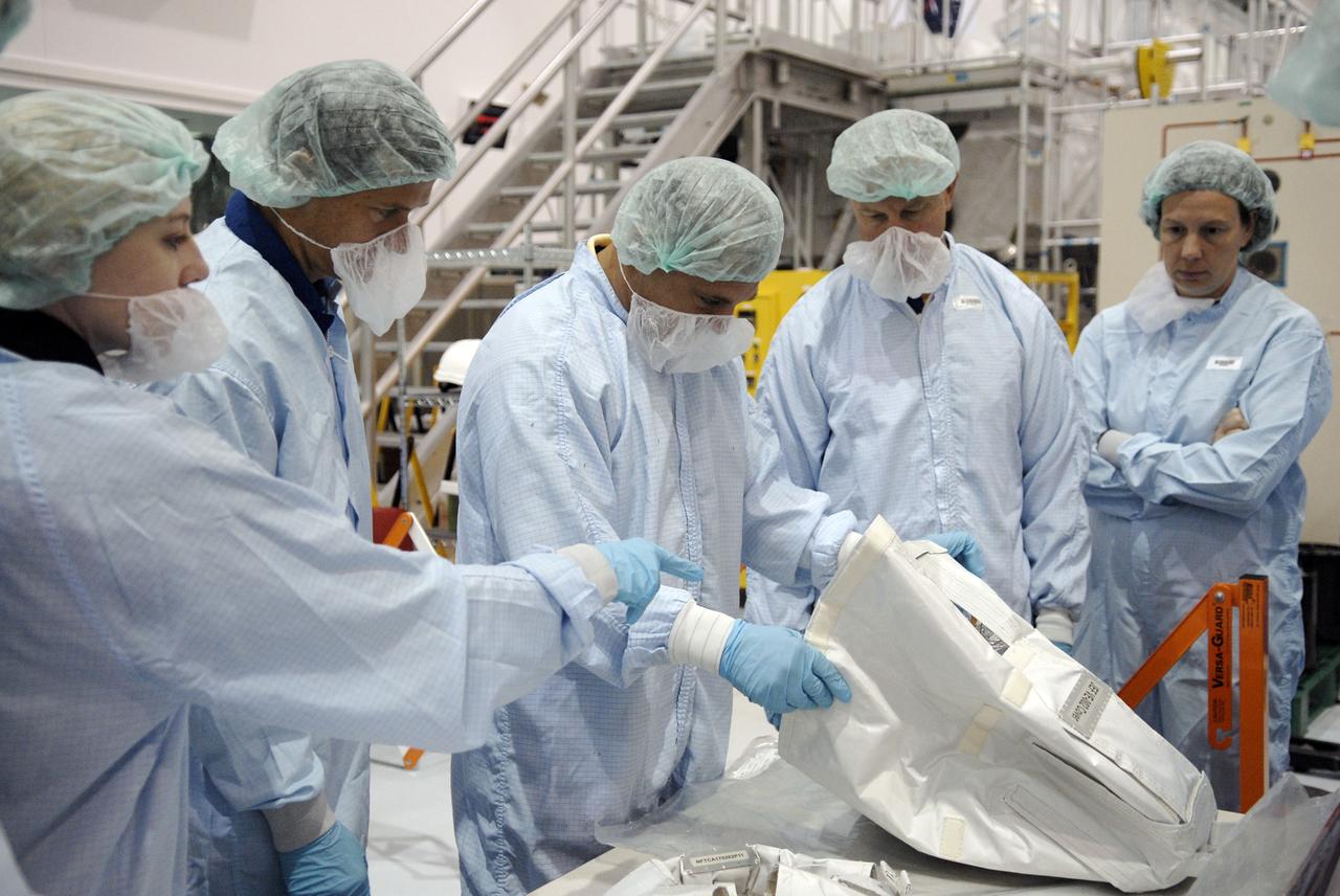 CAPE CANAVERAL, Fla. – In the Space Station Processing Facility at NASA's Kennedy Space Center in Florida, STS-127 mission crew members get hands-on familiarization with equipment to be used on the mission. Crew members are Commander Mark Polansky, Pilot Doug Hurley and Mission Specialists Christopher Cassidy, Tom Marshburn, Dave Wolf, Julie Payette and Tim Kopra. The mission payload includes the Japanese Experiment Module, or JEM, Extended Facility and the Inter-orbit Communication System Extended Facility, or ICS-EF. Equipment familiarization is part of a Crew Equipment Interface Test. The payload will be launched to the International Space Station aboard the space shuttle Endeavour on the STS-127 mission, targeted for launch on May 15, 2009. Photo credit: NASA/Kim Shiflett