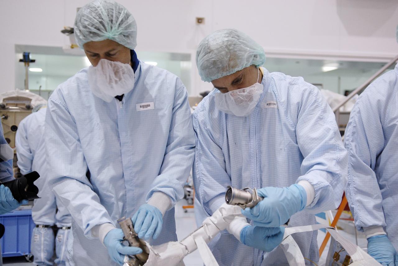 CAPE CANAVERAL, Fla. – In the Space Station Processing Facility at NASA's Kennedy Space Center in Florida, STS-127 mission crew members get hands-on familiarization with equipment to be used on the mission. Crew members are Commander Mark Polansky, Pilot Doug Hurley and Mission Specialists Christopher Cassidy, Tom Marshburn, Dave Wolf, Julie Payette and Tim Kopra. The mission payload includes the Japanese Experiment Module, or JEM, Extended Facility and the Inter-orbit Communication System Extended Facility, or ICS-EF. Equipment familiarization is part of a Crew Equipment Interface Test. The payload will be launched to the International Space Station aboard the space shuttle Endeavour on the STS-127 mission, targeted for launch on May 15, 2009. Photo credit: NASA/Kim Shiflett