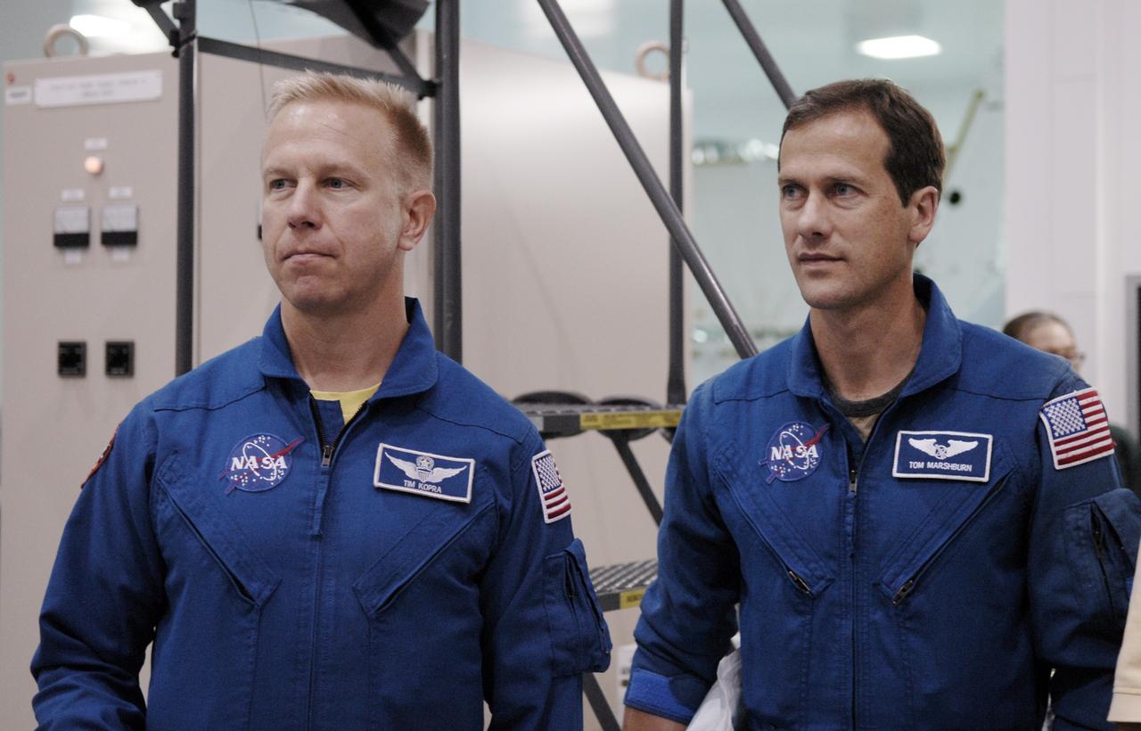 CAPE CANAVERAL, Fla. – STS-127 Mission Specialists Tim Kopra (left) and Tom Marshburn are in the Space Station Processing Facility at NASA's Kennedy Space Center in Florida to gain familiarization with hardware and equipment that will be used on the mission. Other crew members are Commander Mark Polansky, Pilot Doug Hurley and Mission Specialists Christopher Cassidy, Dave Wolf and Julie Payette. The mission payload includes the Japanese Experiment Module, or JEM, Extended Facility and the Inter-orbit Communication System Extended Facility, or ICS-EF. Equipment familiarization is part of a Crew Equipment Interface Test. The payload will be launched to the International Space Station aboard the space shuttle Endeavour on the STS-127 mission, targeted for launch on May 15, 2009. Photo credit: NASA/Kim Shiflett