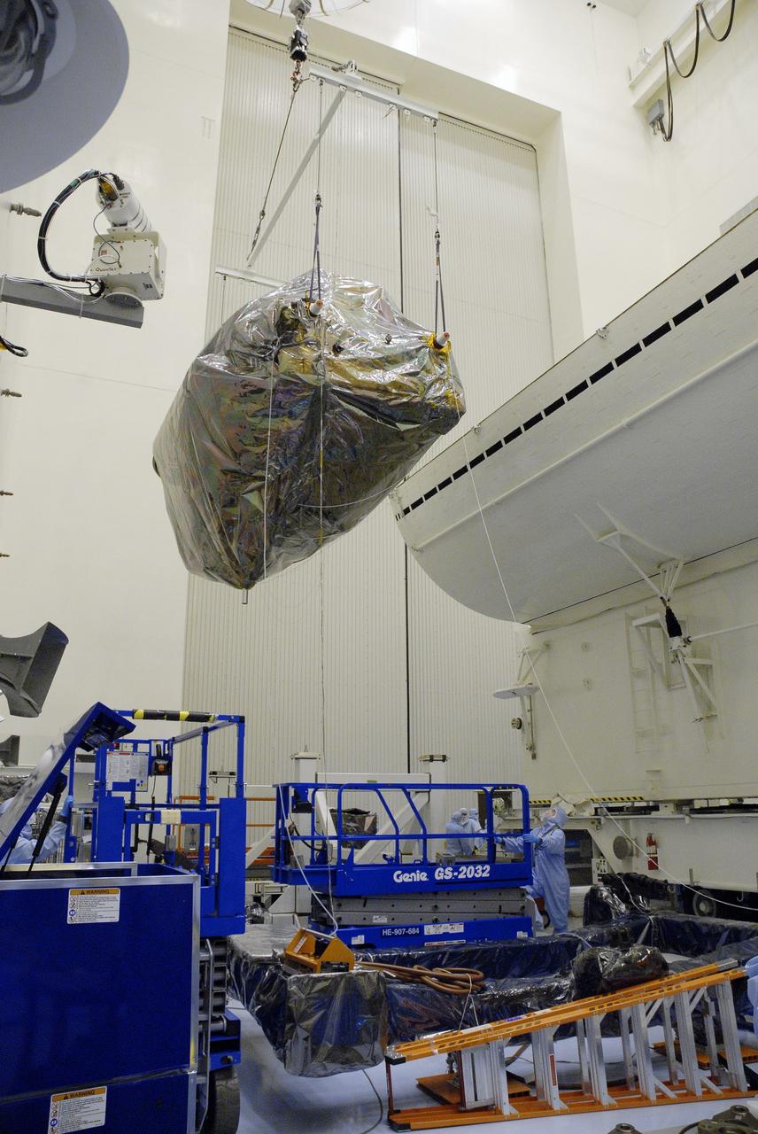 CAPE CANAVERAL, Fla. - In the Payload Hazardous Servicing Facility, or PHSF, at NASA's Kennedy Space Center in Florida, the Super Lightweight Interchangeable Carrier, or SLIC, is lifted from the payload canister which transported the Hubble Space Telescope equipment back to the clean room from Launch Pad 39A.   The payload for Hubble servicing mission 4 comprises four carriers holding various equipment for the mission. In the PHSF, the carriers will be stored until a new target launch date in 2009 can be set for Atlantis’ STS-125 mission. Atlantis’ October target launch date was delayed after a device on board Hubble, used in the storage and transmission of science data to Earth, shut down on Sept. 27. Replacing the broken device will be added to Atlantis’ servicing mission to the telescope.  Photo credit: NASA/Jim Grossmann