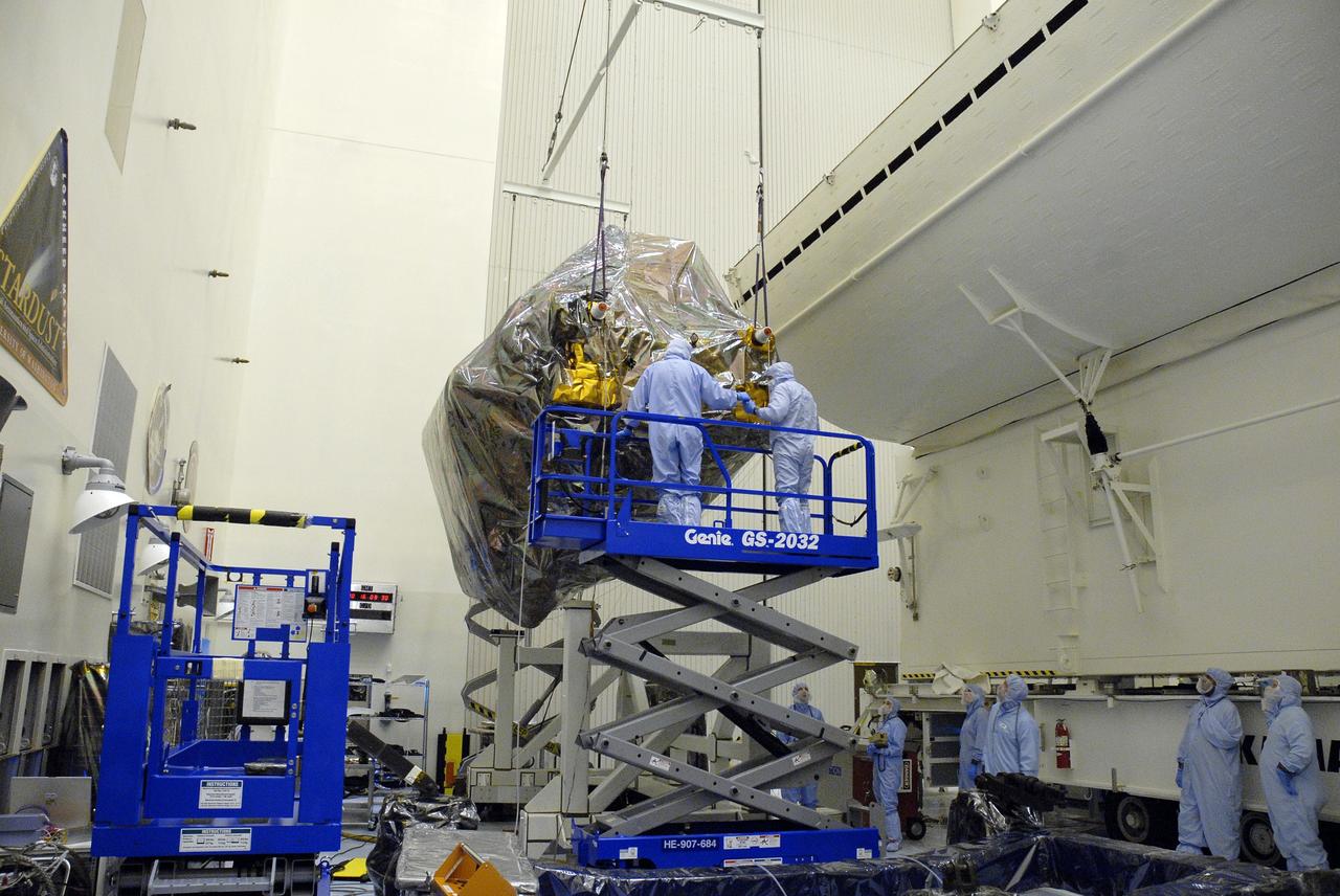 CAPE CANAVERAL, Fla. - In the Payload Hazardous Servicing Facility, or PHSF, at NASA's Kennedy Space Center in Florida, workers remove the Super Lightweight Interchangeable Carrier, or SLIC, from the payload canister which transported the Hubble Space Telescope equipment back to the clean room from Launch Pad 39A.  The payload for Hubble servicing mission 4 comprises four carriers holding various equipment for the mission. In the PHSF, the carriers will be stored until a new target launch date in 2009 can be set for Atlantis’ STS-125 mission. Atlantis’ October target launch date was delayed after a device on board Hubble, used in the storage and transmission of science data to Earth, shut down on Sept. 27. Replacing the broken device will be added to Atlantis’ servicing mission to the telescope.  Photo credit: NASA/Jim Grossmann