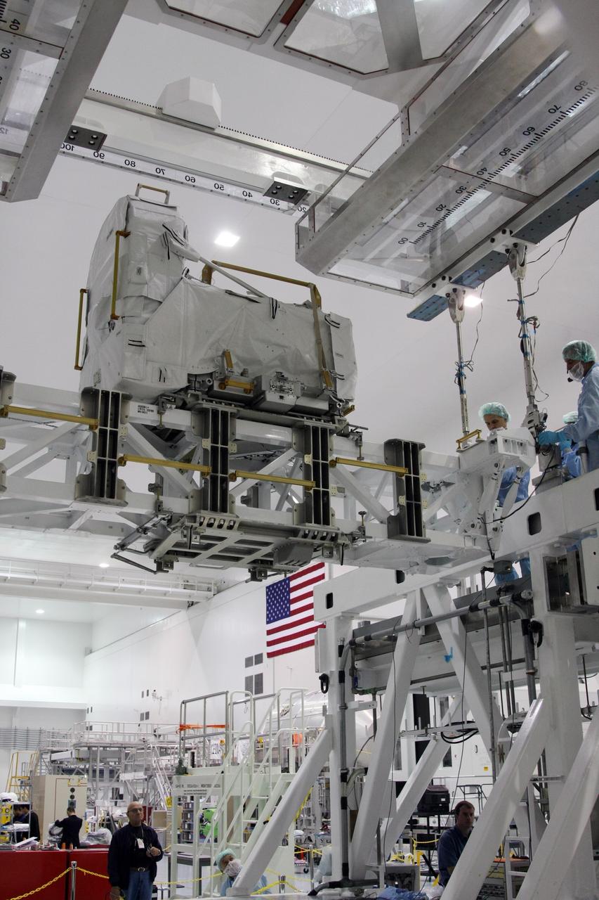 CAPE CANAVERAL, Fla. - The Lightweight Multi-Purpose Experiment Support Structure Carrier with the flexible hose rotary coupler is moved across the Space Station Processing Facility at NASA's Kennedy Space Center in Florida. It will be installed in the payload canister. The carrier is part of space shuttle Endeavour's payload on the STS-126 mission to the International Space Station. Endeavour will also carry the Multi-Purpose Logistics Module Leonardo holding supplies and equipment, including additional crew quarters, equipment for the regenerative life support system and spare hardware. Endeavour is targeted for launch on Nov. 14. Photo credit: NASA/Dimitri Gerondidakis