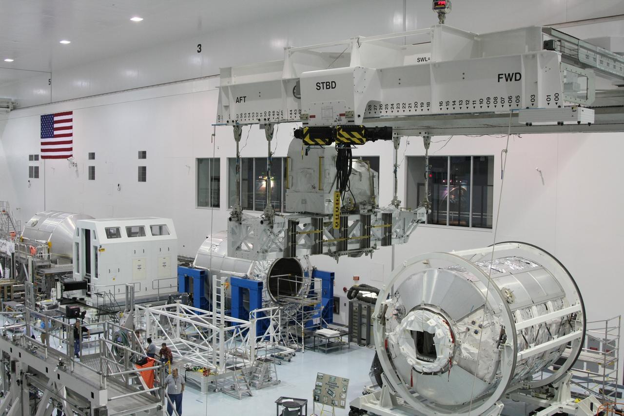 CAPE CANAVERAL, Fla. - The Lightweight Multi-Purpose Experiment Support Structure Carrier with the flexible hose rotary coupler is moved across the Space Station Processing Facility at NASA's Kennedy Space Center in Florida. It will be installed in the payload canister. The carrier is part of space shuttle Endeavour's payload on the STS-126 mission to the International Space Station. Endeavour will also carry the Multi-Purpose Logistics Module Leonardo holding supplies and equipment, including additional crew quarters, equipment for the regenerative life support system and spare hardware. Endeavour is targeted for launch on Nov. 14. Photo credit: NASA/Dimitri Gerondidakis