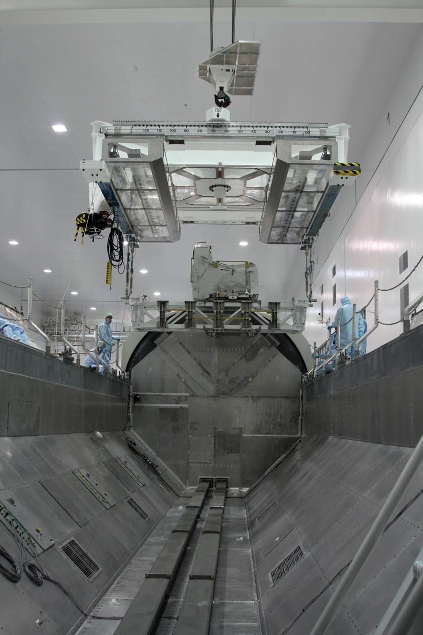 CAPE CANAVERAL, Fla. -  The Lightweight Multi-Purpose Experiment Support Structure Carrier with the flexible hose rotary coupler is lowered into the payload canister in the Space Station Processing Facility at NASA's Kennedy Space Center in Florida. The carrier is part of space shuttle Endeavour's payload on the STS-126 mission to the International Space Station. Endeavour will also carry the Multi-Purpose Logistics Module Leonardo holding supplies and equipment, including additional crew quarters, equipment for the regenerative life support system and spare hardware. Endeavour is targeted for launch on Nov. 14.  Photo credit: NASA/Dimitri Gerondidakis