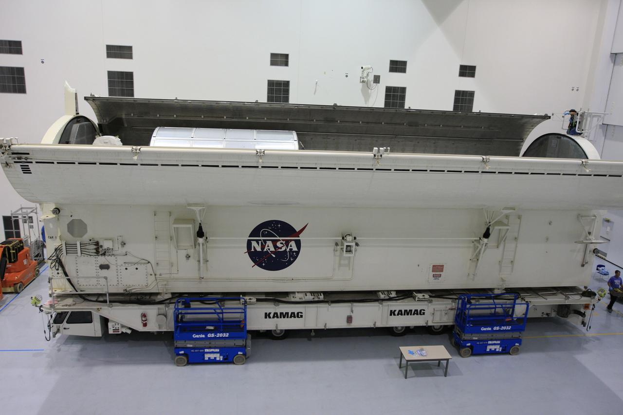 CAPE CANAVERAL, Fla. -  In the Space Station Processing Facility at NASA's Kennedy Space Center in Florida, the doors of the payload canister are closing over the payload for space shuttle Endeavour's STS-126 mission.  Inside the canister are the Multi-Purpose Logistics Module Leonardo and the Lightweight Multi-Purpose Experiment Support Structure Carrier.  The canister next will be transported to the Canister Rotation Facility to raise it to vertical and then will be taken to Launch Pad 39A. At the pad, the payload canister will release its cargo into the Payload Changeout Room.  Later, the payload will be installed in Endeavour's payload bay.  Endeavour is targeted for launch on Nov. 14.  Photo credit: NASA/Troy Cryder