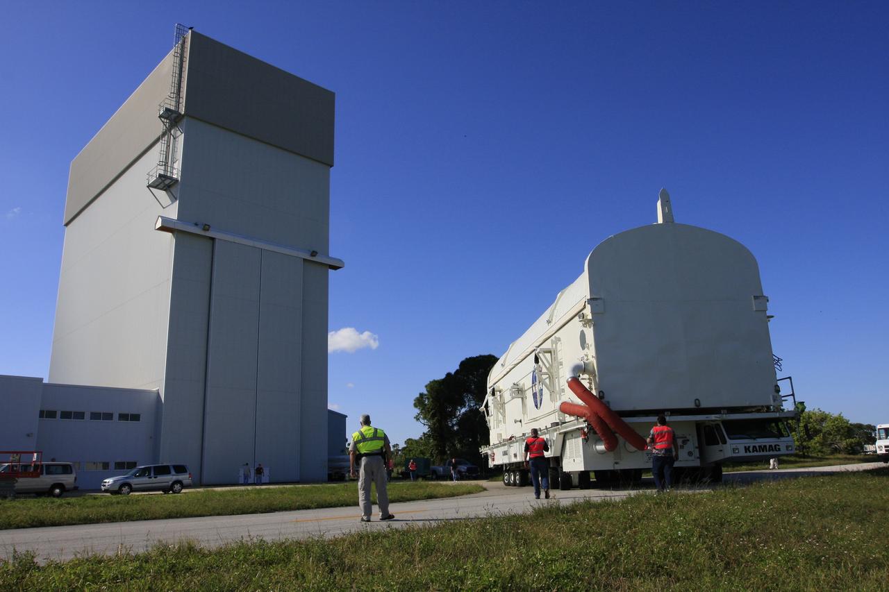 CAPE CANAVERAL, Fla. -    The payload canister containing the payload for space shuttle Endeavour's STS-126 mission backs away from the Space Station Processing Facility at NASA's Kennedy Space Center in Florida.  Inside the canister are the Multi-Purpose Logistics Module Leonardo and the Lightweight Multi-Purpose Experiment Support Structure Carrier.  The canister will be transported to the Canister Rotation Facility to raise it to vertical and then will be taken to Launch Pad 39A. At the pad, the payload canister will release its cargo into the Payload Changeout Room.  Later, the payload will be installed in Endeavour's payload bay.  Endeavour is targeted for launch on Nov. 14.  Photo credit: NASA/Troy Cryder