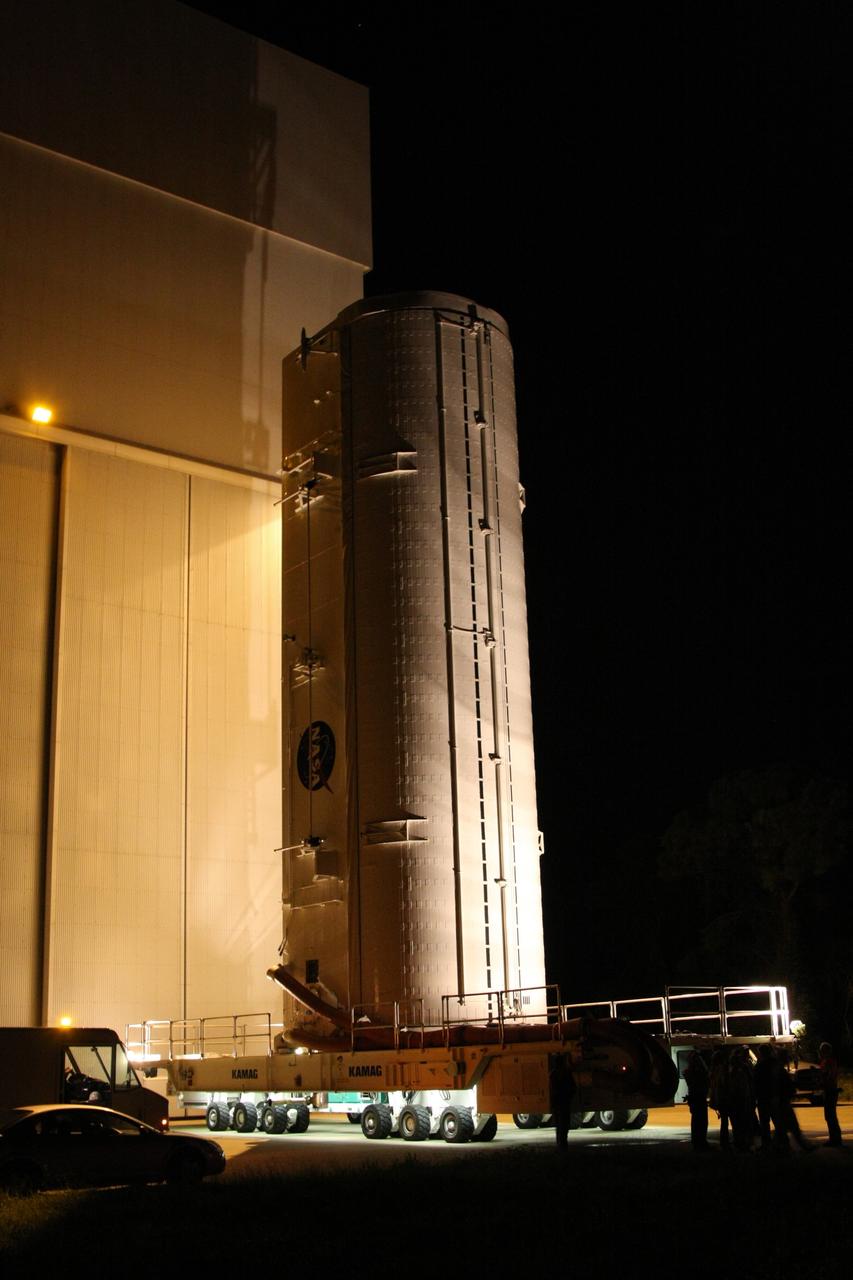 CAPE CANAVERAL, Fla. -   In its vertical position, the payload canister with space shuttle Endeavour's STS-126 mission payload inside leaves the Canister Rotation Facility at NASA's Kennedy Space Center in Florida.  Inside the canister are the Multi-Purpose Logistics Module Leonardo and the Lightweight Multi-Purpose Experiment Support Structure Carrier. At the pad, the payload canister will release its cargo into the Payload Changeout Room.  Later, the payload will be installed in Endeavour's payload bay.  Endeavour is targeted for launch on Nov. 14. Photo credit: NASA/Dimitri Gerondidakis