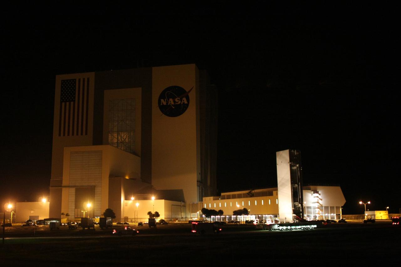 CAPE CANAVERAL, Fla. - In the early morning hours, the payload canister with space shuttle Endeavour's STS-126 mission payload inside travels past the Vehicle Assembly Building on its way to Launch Pad 39A at NASA's Kennedy Space Center in Florida. Inside the canister are the Multi-Purpose Logistics Module Leonardo and the Lightweight Multi-Purpose Experiment Support Structure Carrier. At the pad, the payload canister will release its cargo into the Payload Changeout Room. Later, the payload will be installed in Endeavour's payload bay. Endeavour is targeted for launch on Nov. 14. Photo credit: NASA/Dimitri Gerondidakis