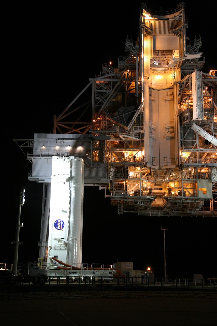 CAPE CANAVERAL, Fla. - Spotlighted in the dark of early morning, the payload canister with space shuttle Endeavour's STS-126 mission payload inside arrives on Launch Pad 39A at NASA's Kennedy Space Center in Florida. Inside the canister are the Multi-Purpose Logistics Module Leonardo and the Lightweight Multi-Purpose Experiment Support Structure Carrier. At right is the rotating service structure with the Payload Changeout Room, or PCR, above. The payload canister will release its cargo into the PCR. Later, the payload will be installed in Endeavour's payload bay. Endeavour is targeted for launch on Nov. 14. Photo credit: NASA/Dimitri Gerondidakis