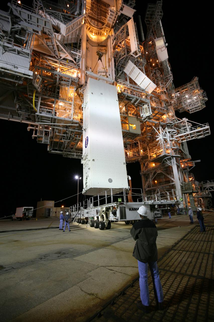 CAPE CANAVERAL, Fla. - On Launch Pad 39A at NASA's Kennedy Space Center in Florida, the payload canister with space shuttle Endeavour's STS-126 mission payload inside is lifted off its transporter toward the Payload Changeout Room, or PCR, above. Inside the canister are the Multi-Purpose Logistics Module Leonardo and the Lightweight Multi-Purpose Experiment Support Structure Carrier. The payload canister will release its cargo into the PCR. Later, the payload will be installed in Endeavour's payload bay. Endeavour is targeted for launch on Nov. 14. Photo credit: NASA/Dimitri Gerondidakis