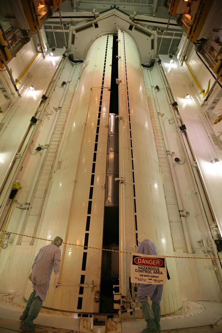 CAPE CANAVERAL, Fla. - From inside the Payload Changeout Room on Launch Pad 39A at NASA's Kennedy Space Center in Florida, workers oversee the opening of the doors of the payload canister. The canister contains space shuttle Endeavour's STS-126 mission payload, the Multi-Purpose Logistics Module Leonardo and the Lightweight Multi-Purpose Experiment Support Structure Carrier. The payload will be moved into the PCR. Later, the payload will be installed in Endeavour's payload bay. Endeavour is targeted for launch on Nov. 14. Photo credit: NASA/Dimitri Gerondidakis