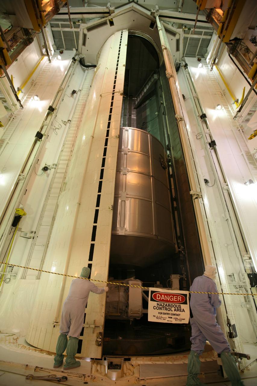 CAPE CANAVERAL, Fla. -  From inside the Payload Changeout Room on Launch Pad 39A at NASA's Kennedy Space Center in Florida, workers oversee the opening of the doors of the payload canister.  The canister contains space shuttle Endeavour's STS-126 mission payload, the Multi-Purpose Logistics Module Leonardo (center) and the Lightweight Multi-Purpose Experiment Support Structure Carrier (bottom). The payload will be moved into the PCR.  Later, the payload will be installed in Endeavour's payload bay.  Endeavour is targeted for launch on Nov. 14.  Photo credit: NASA/Dimitri Gerondidakis