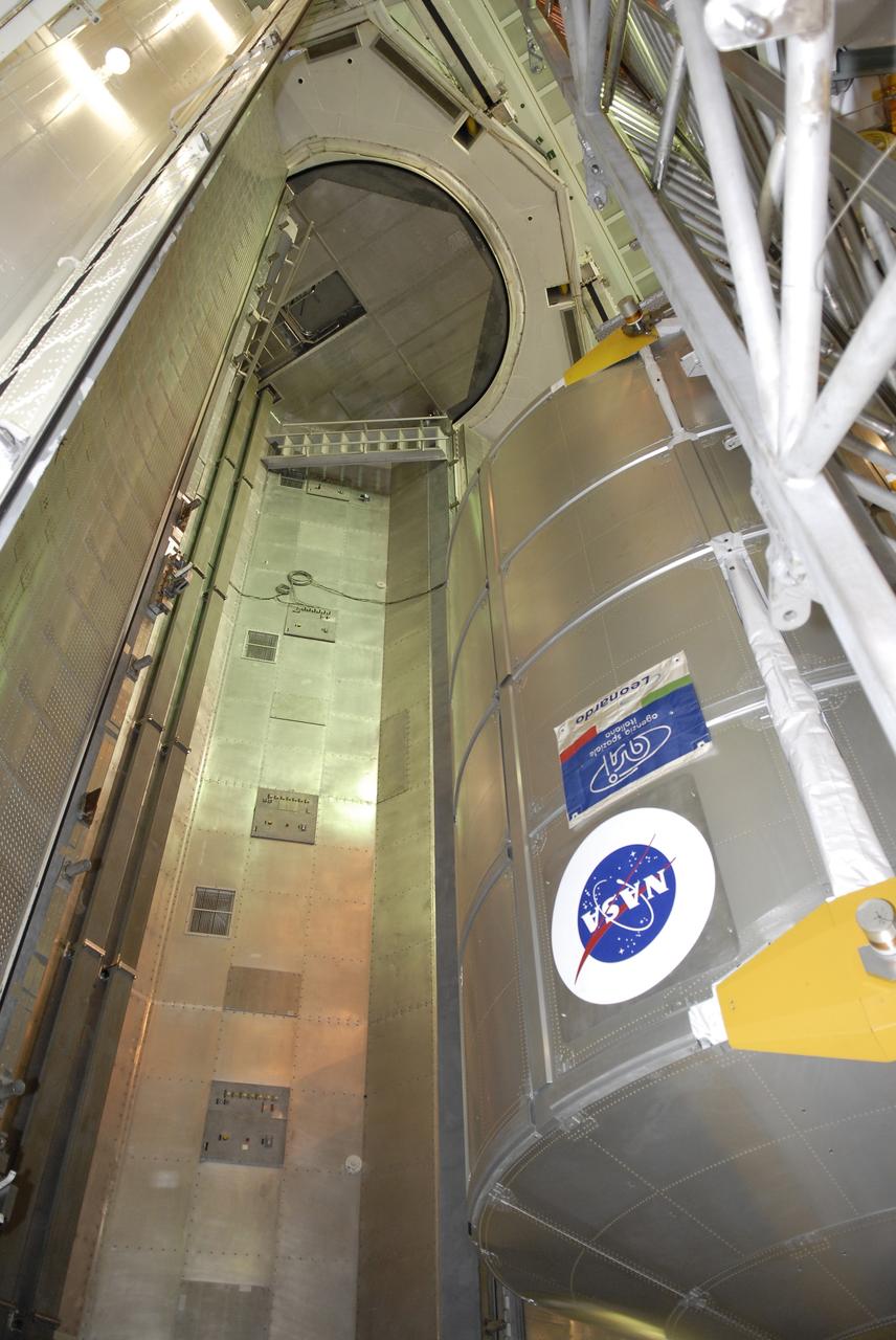CAPE CANAVERAL, Fla. -  In the Payload Changeout Room, or PCR, on Launch Pad 39A at NASA's Kennedy Space Center in Florida, space shuttle Endeavour's STS-126 mission payload is transferred from the payload canister into the PCR.  Seen at right is the Multi-Purpose Logistics Module Leonardo. The payload later will be installed in Endeavour's payload bay.  Endeavour is targeted for launch on Nov. 14. Photo credit: NASA/Kim Shiflett