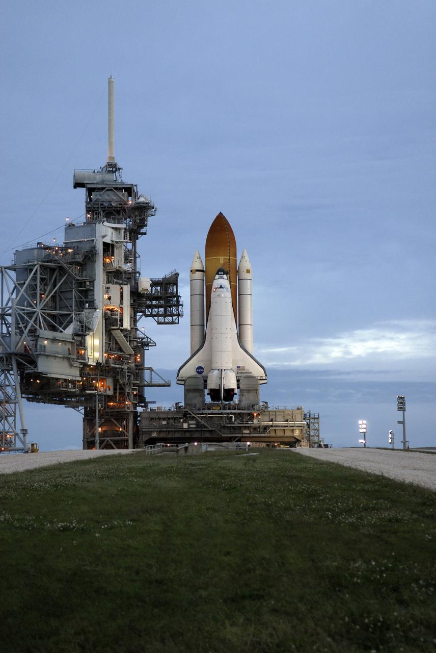 CAPE CANAVERAL, Fla. - At NASA's Kennedy Space Center in Florida, space shuttle Endeavour waits to begin rolling off Launch Pad 39B for the 3.4-mile rollaround to Launch Pad 39A. First motion was at 8:28 a.m. EDT. To the left is the open rotating service structure and the fixed service structure with the 80-foot-tall lightning mast on top. Endeavour is targeted to launch Nov. 14 on the STS-126 mission. On this 27th mission to the International Space Station, Endeavour will carry the Lightweight Multi-Purpose Experiment Support Structure Carrier and the Multi-Purpose Logistics Module Leonardo that will hold supplies and equipment, including additional crew quarters, additional exercise equipment, spare hardware and equipment for the regenerative life support system. Photo credit: NASA/Kim Shiflett