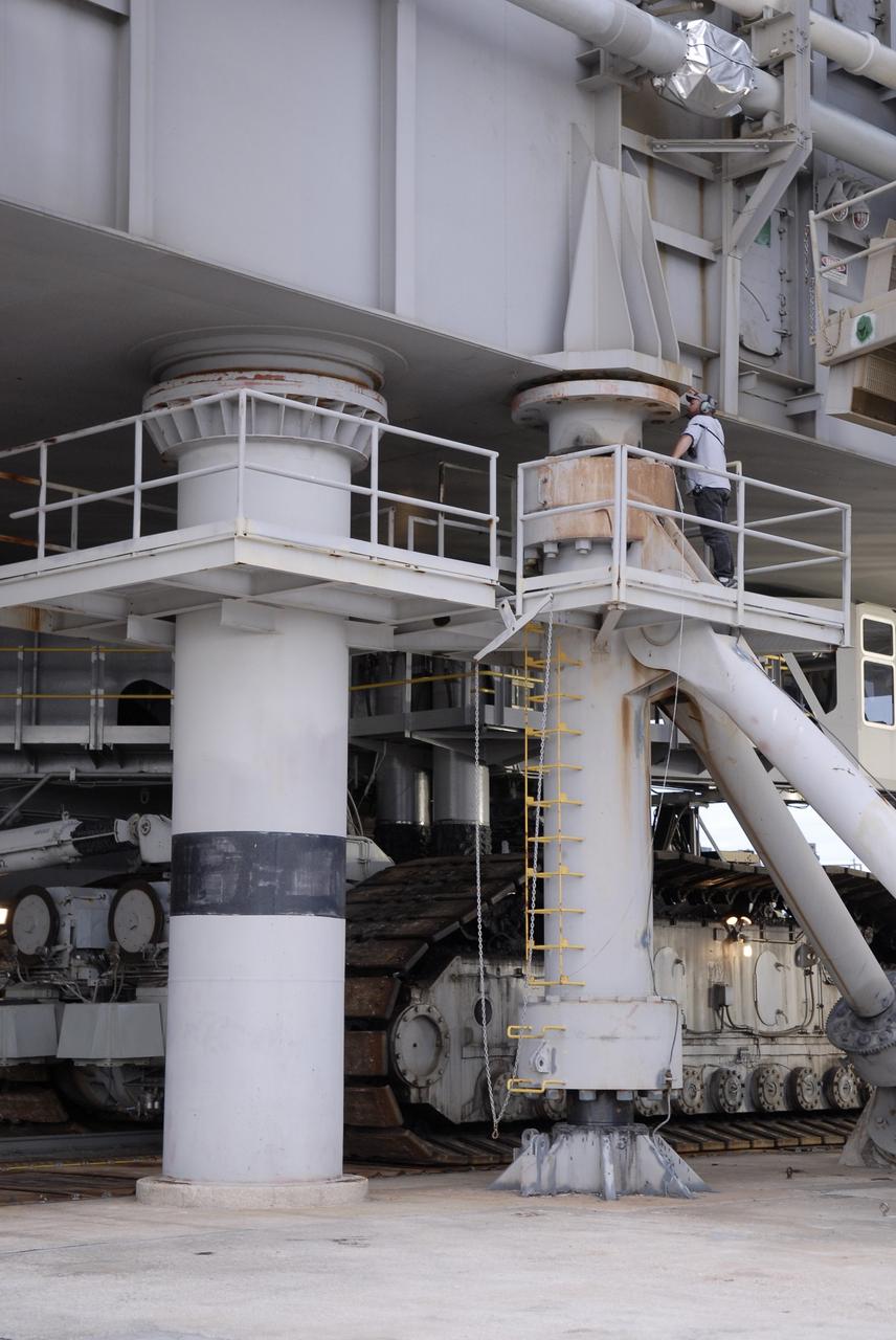CAPE CANAVERAL, Fla. - On Launch Pad 39B at NASA's Kennedy Space Center in Florida, a worker checks for distance between the bottom of the mobile launcher platform and the top of the mount mechanism as space shuttle Endeavour is prepared to roll off the pad. First motion was at 8:28 a.m. EDT. Endeavour is targeted to launch Nov. 14 on the STS-126 mission. On this 27th mission to the International Space Station, Endeavour will carry the Lightweight Multi-Purpose Experiment Support Structure Carrier and the Multi-Purpose Logistics Module Leonardo that will hold supplies and equipment, including additional crew quarters, additional exercise equipment, spare hardware and equipment for the regenerative life support system. Photo credit: NASA/Kim Shiflett