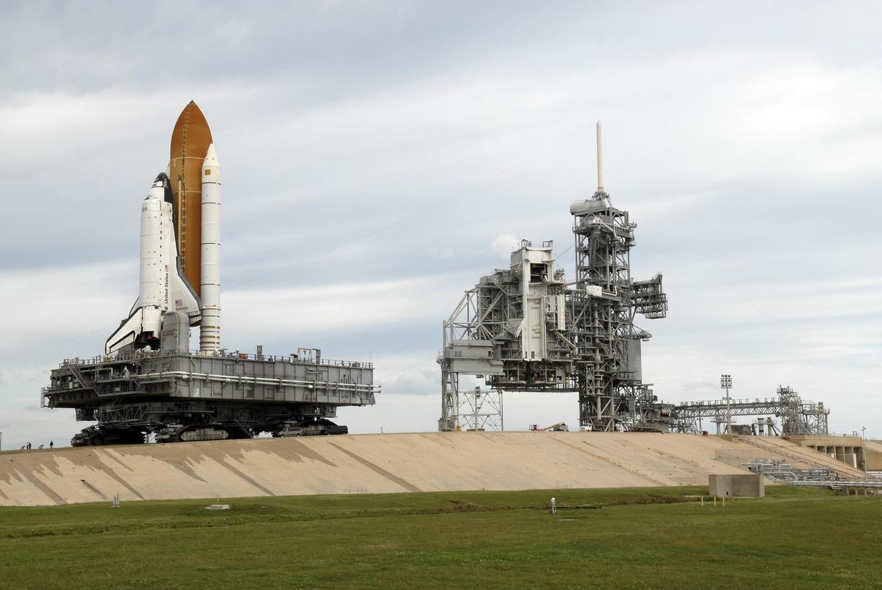 CAPE CANAVERAL, Fla. - A view of Launch Pad 39B at NASA's Kennedy Space Center in Florida shows space shuttle Endeavour rolling off the pad for the 3.4-mile rollaround to Launch Pad 39A. First motion was at 8:28 a.m. EDT. At right is the open rotating service structure with the Payload Changeout Room and the fixed service structure with the 80-foot-tall lightning mast on top. Endeavour is targeted to launch Nov. 14 on the STS-126 mission. On this 27th mission to the International Space Station, Endeavour will carry the Lightweight Multi-Purpose Experiment Support Structure Carrier and the Multi-Purpose Logistics Module Leonardo that will hold supplies and equipment, including additional crew quarters, additional exercise equipment, spare hardware and equipment for the regenerative life support system. Photo credit: NASA/Kim Shiflett