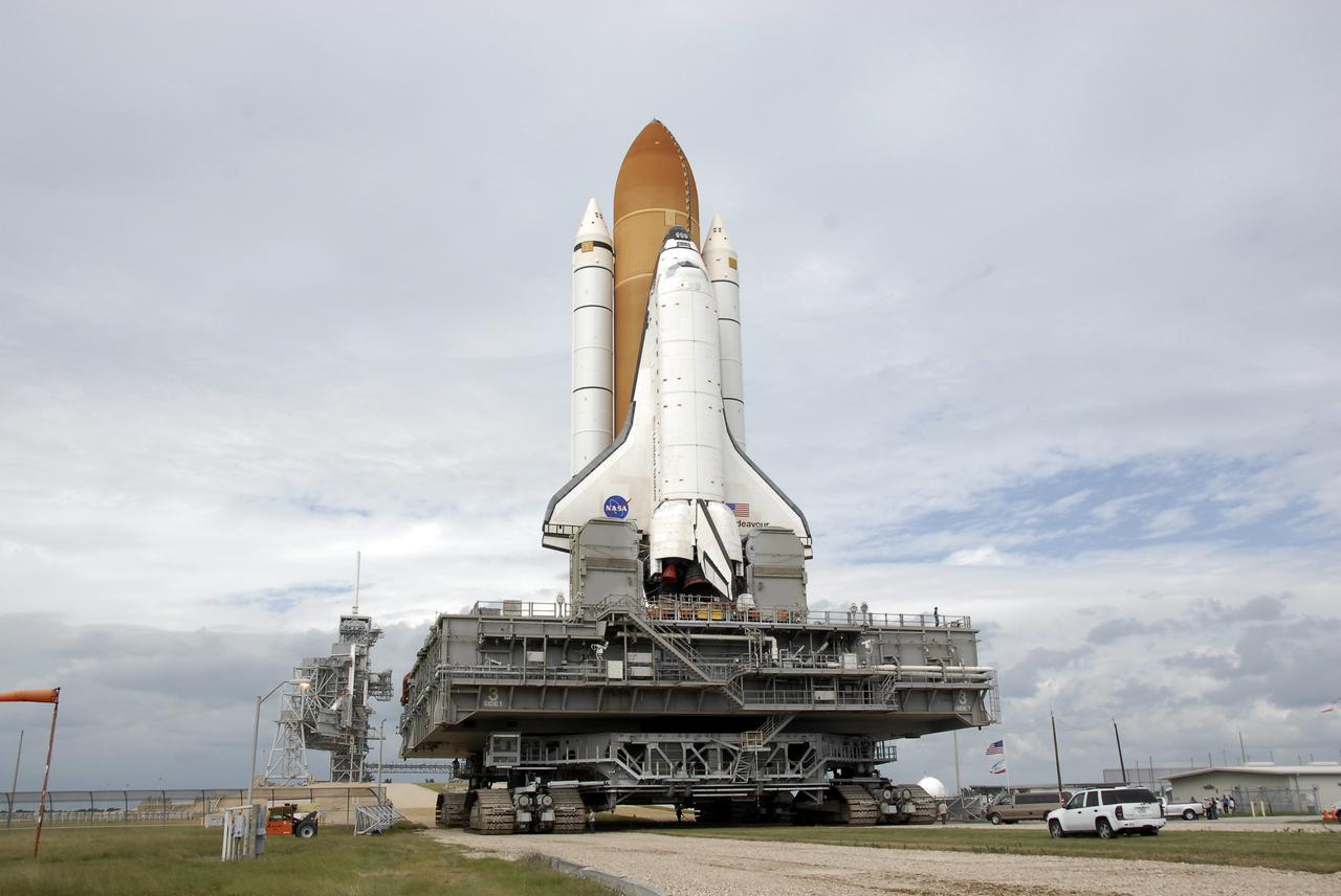 CAPE CANAVERAL, Fla. - At NASA's Kennedy Space Center in Florida, space shuttle Endeavour rolls through the gate at Launch Pad 39A.  The shuttle earlier moved off Launch Pad 39B starting at 8:28 am. EDT to head for pad 39A.  Endeavour completed its move to Launch Pad 39A at 4:37 p.m. Endeavour is targeted to launch Nov. 14 on the STS-126 mission. On this 27th mission to the International Space Station, Endeavour will carry the Lightweight Multi-Purpose Experiment Support Structure Carrier and the Multi-Purpose Logistics Module Leonardo that will hold supplies and equipment, including additional crew quarters, additional exercise equipment, spare hardware and equipment for the regenerative life support system.  Photo credit: NASA/Kim Shiflett