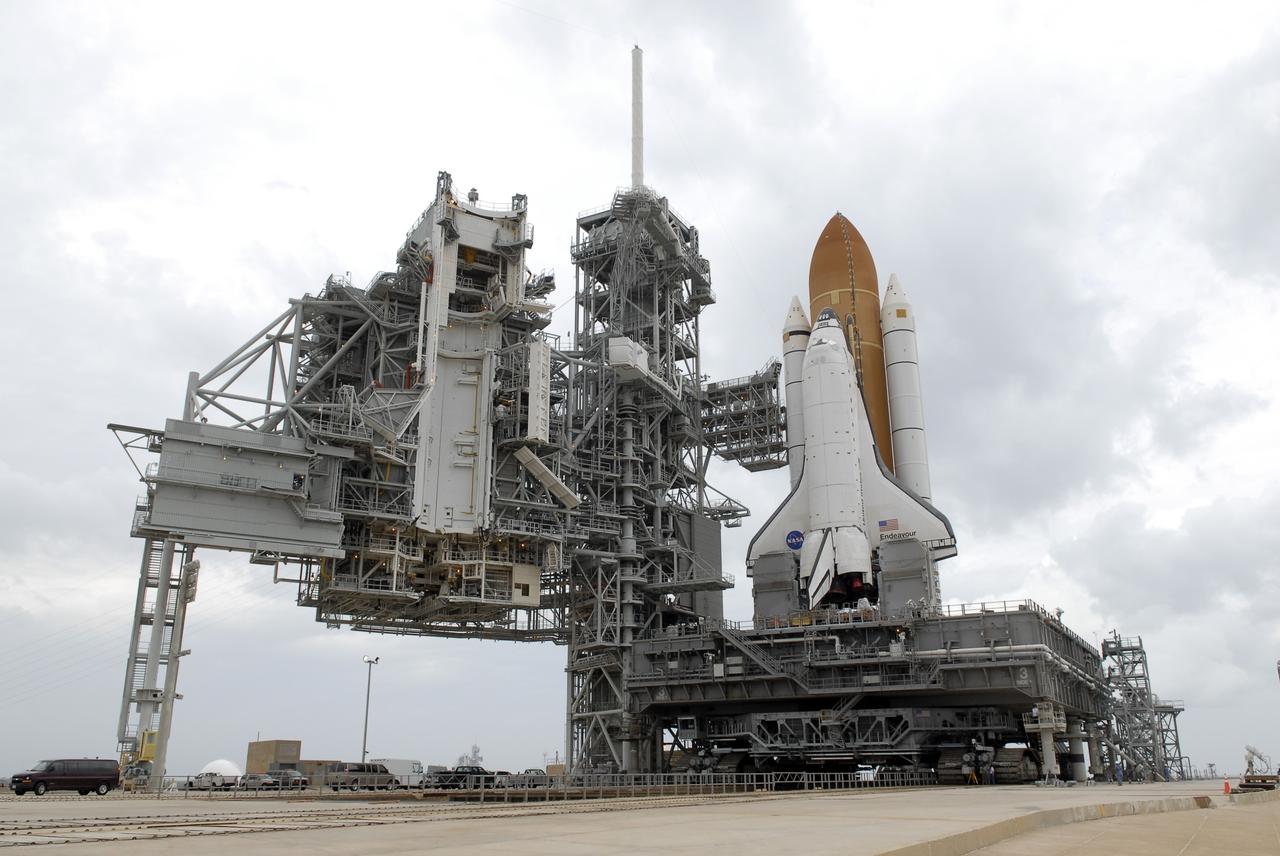 CAPE CANAVERAL, Fla. -  At NASA's Kennedy Space Center in Florida, space shuttle Endeavour, atop the mobile launcher platform, comes to rest on Launch Pad 39A  after rolling around from launch Pad 39B.  At left are the open rotating service structure and the fixed service structure with the 80-foot-tall lightning mast on top. The shuttle moved off Launch Pad 39B starting at 8:28 am. EDT and completed its move to Launch Pad 39A at 4:37 p.m. Endeavour is targeted to launch Nov. 14 on the STS-126 mission.  On this 27th mission to the International Space Station, Endeavour will carry the Lightweight Multi-Purpose Experiment Support Structure Carrier and the Multi-Purpose Logistics Module Leonardo that will hold supplies and equipment, including additional crew quarters, additional exercise equipment, spare hardware and equipment for the regenerative life support system.  Photo credit: NASA/Kim Shiflett