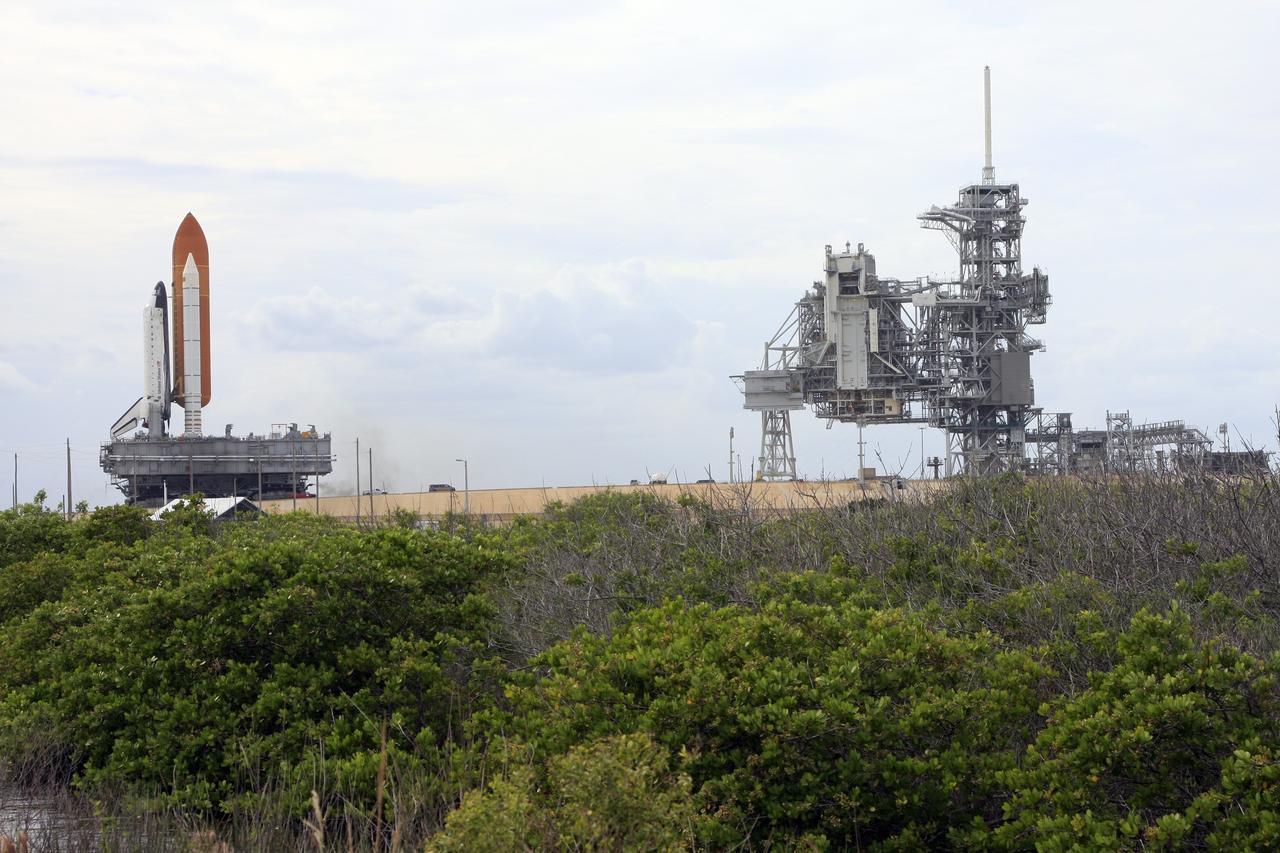 CAPE CANAVERAL, Fla. -  At NASA's Kennedy Space Center in Florida, space shuttle Endeavour rolls up the ramp toward Launch Pad 39A.  At right are the open rotating service structure and the fixed service structure with the 80-foot-tall lightning mast on top.  The shuttle moved off Launch Pad 39B starting at 8:28 am. EDT and completed its move to Launch Pad 39A at 4:37 p.m. Endeavour is targeted to launch Nov. 14 on the STS-126 mission. On this 27th mission to the International Space Station, Endeavour will carry the Lightweight Multi-Purpose Experiment Support Structure Carrier and the Multi-Purpose Logistics Module Leonardo that will hold supplies and equipment, including additional crew quarters, additional exercise equipment, spare hardware and equipment for the regenerative life support system.  Photo credit: NASA/Troy Cryder