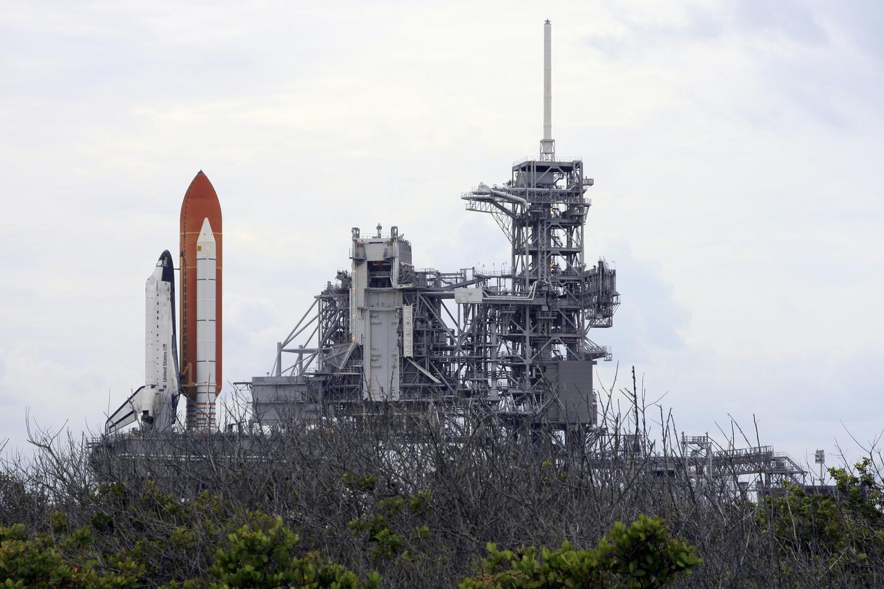 CAPE CANAVERAL, Fla. – At NASA's Kennedy Space Center in Florida, space shuttle Endeavour rolls to the top of Launch Pad 39A.  At right are the open rotating service structure and the fixed service structure with the 80-foot-tall lightning mast on top.  The shuttle moved off Launch Pad 39B starting at 8:28 am. EDT and completed its move to Launch Pad 39A at 4:37 p.m. Endeavour is targeted to launch Nov. 14 on the STS-126 mission. On this 27th mission to the International Space Station, Endeavour will carry the Lightweight Multi-Purpose Experiment Support Structure Carrier and the Multi-Purpose Logistics Module Leonardo that will hold supplies and equipment, including additional crew quarters, additional exercise equipment, spare hardware and equipment for the regenerative life support system.  Photo credit: NASA/Troy Cryder