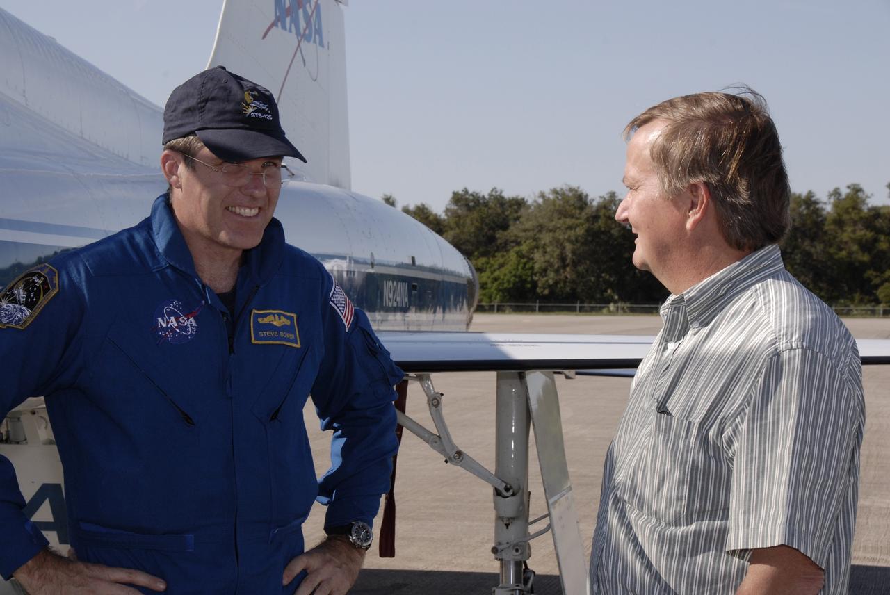 CAPE CANAVERAL, Fla. - STS-126 Mission Specialist Steve Bowen, left, is greeted by Shuttle Launch Director Mike Linebach following his arrival at the Shuttle Landing Facility at NASA’s Kennedy Space Center in Florida for Terminal Countdown Demonstration Test, or TCDT, activities. During TCDT, Endeavour's astronauts and launch teams will participate in a simulated countdown, practice emergency exit procedures at the launch pad and continue to familiarize themselves with the mission payload and hardware. On this 27th mission to the International Space Station, Endeavour will carry the Lightweight Multi-Purpose Experiment Support Structure Carrier and the Multi-Purpose Logistics Module Leonardo that will hold supplies and equipment, including additional crew quarters, additional exercise equipment, spare hardware and equipment for the regenerative life support system. Endeavour is targeted to launch at 7:55 p.m. EST on Nov. 14. Photo credit: NASA/Kim Shiflett