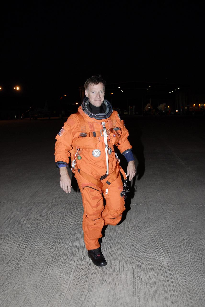 CAPE CANAVERAL, Fla. - At NASA's Kennedy Space Center in Florida, STS-126 Commander Chris Ferguson heads across the parking apron of the Shuttle Landing Facility to the Shuttle Training Aircraft, or STA. He will practice shuttle landings in the STA, a Grumman American Aviation-built Gulf Stream II jet that was modified to simulate a shuttle’s cockpit, motion and visual cues, and handling qualities. In flight, the aircraft duplicates the shuttle’s atmospheric descent trajectory from approximately 35,000 feet to landing. The practice is part of the Terminal Countdown Demonstration Test, which includes equipment familiarization, emergency exit procedures and a simulated launch countdown. On the STS-126 mission, space shuttle Endeavour's crew will deliver equipment and supplies to the International Space Station in preparation for expansion from a three- to six-person resident crew aboard the complex. The mission also will include four spacewalks to service the station’s Solar Alpha Rotary Joints. Endeavour is targeted to launch Nov. 14. Photo credit: NASA/Kim Shiflett