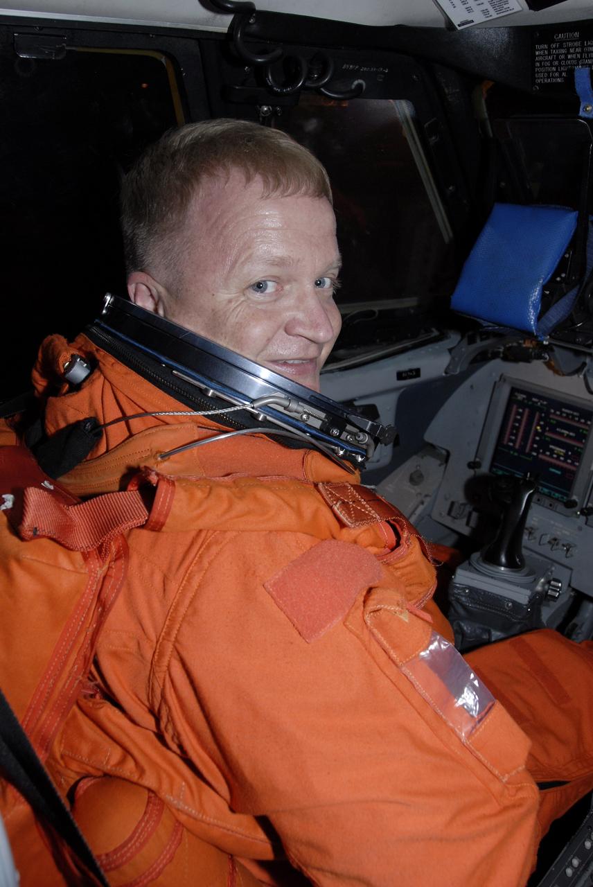 CAPE CANAVERAL, Fla. -  At the Shuttle Landing Facility at NASA's Kennedy Space Center in Florida, STS-126 Pilot Eric Boe takes his seat in the cockpit of the Shuttle Training Aircraft, or STA.  He will practice shuttle landings in the STA, a Grumman American Aviation-built Gulf Stream II jet that was modified to simulate a shuttle’s cockpit, motion and visual cues, and handling qualities. In flight, the aircraft duplicates the shuttle’s atmospheric descent trajectory from approximately 35,000 feet to landing. The practice is part of the Terminal Countdown Demonstration Test, which includes equipment familiarization, emergency exit procedures and a simulated launch countdown.  On the STS-126 mission, space shuttle Endeavour's crew will deliver equipment and supplies to the International Space Station in preparation for expansion from a three- to six-person resident crew aboard the complex. The mission also will include four spacewalks to service the station’s Solar Alpha Rotary Joints. Endeavour is targeted to launch Nov. 14. Photo credit: NASA/Kim Shiflett